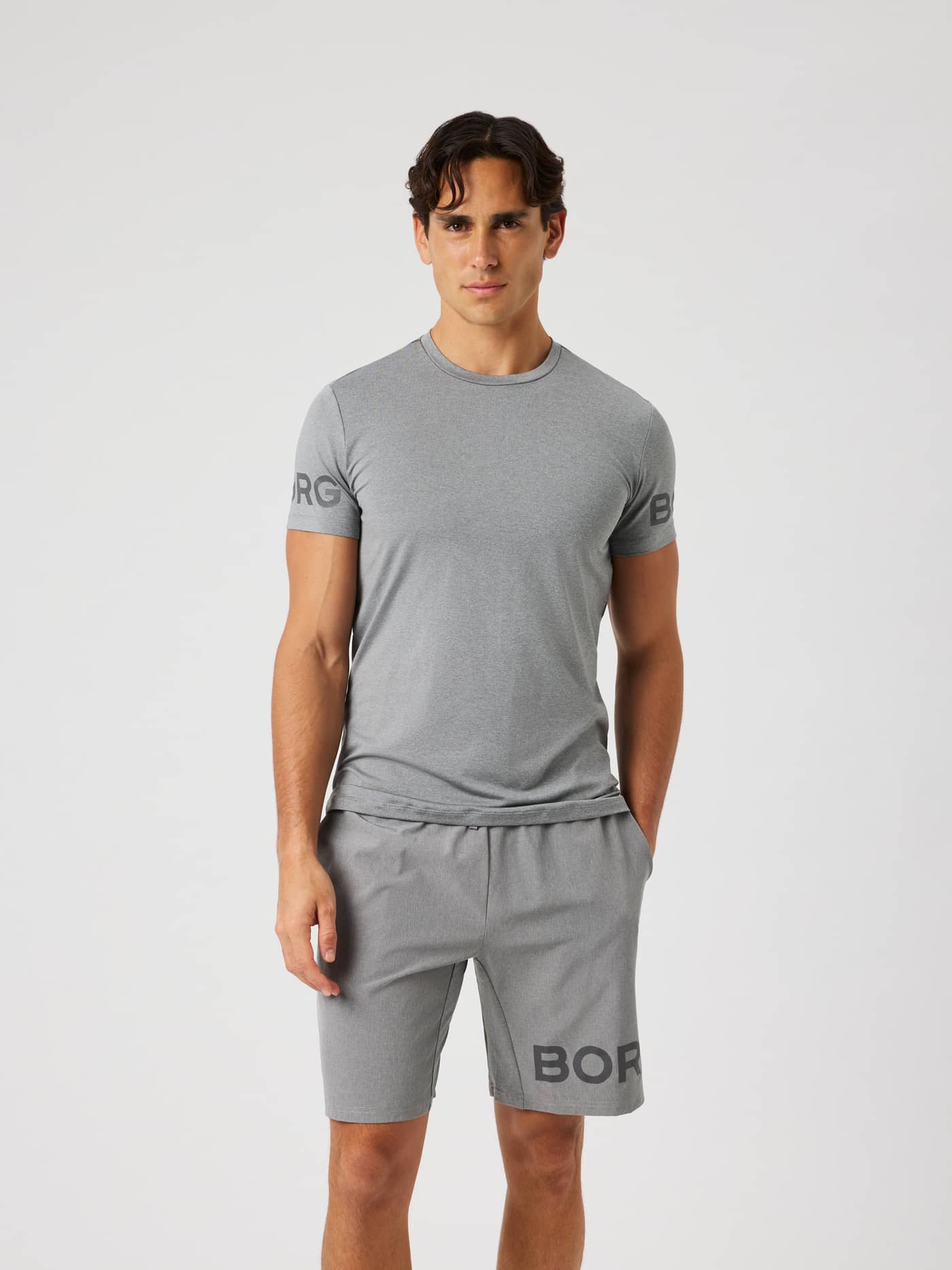 Man wearing the Borg T-Shirt in grey melange (grey) for training. - Image 2