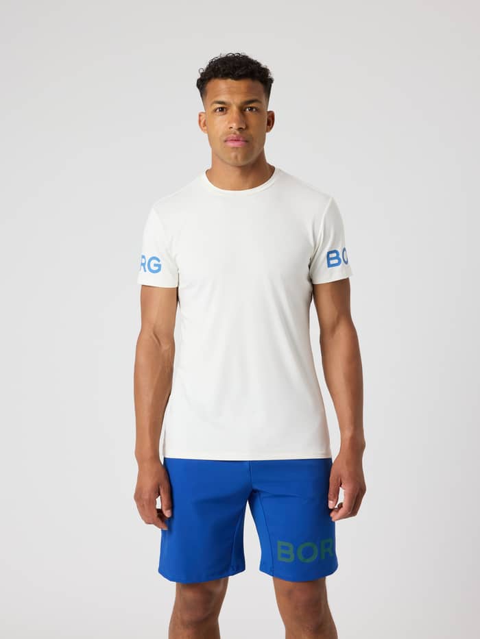 Borg T-Shirt i Tofu (Vit) för herrar sedd framifrån, en funktionell träningströja med blå logotyper på ärmarna.