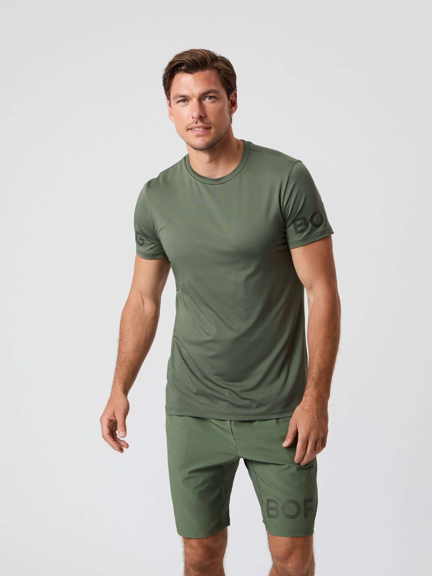 Front view of a male model wearing the Björn Borg Borg T-Shirt in Thyme green. - Image 1
