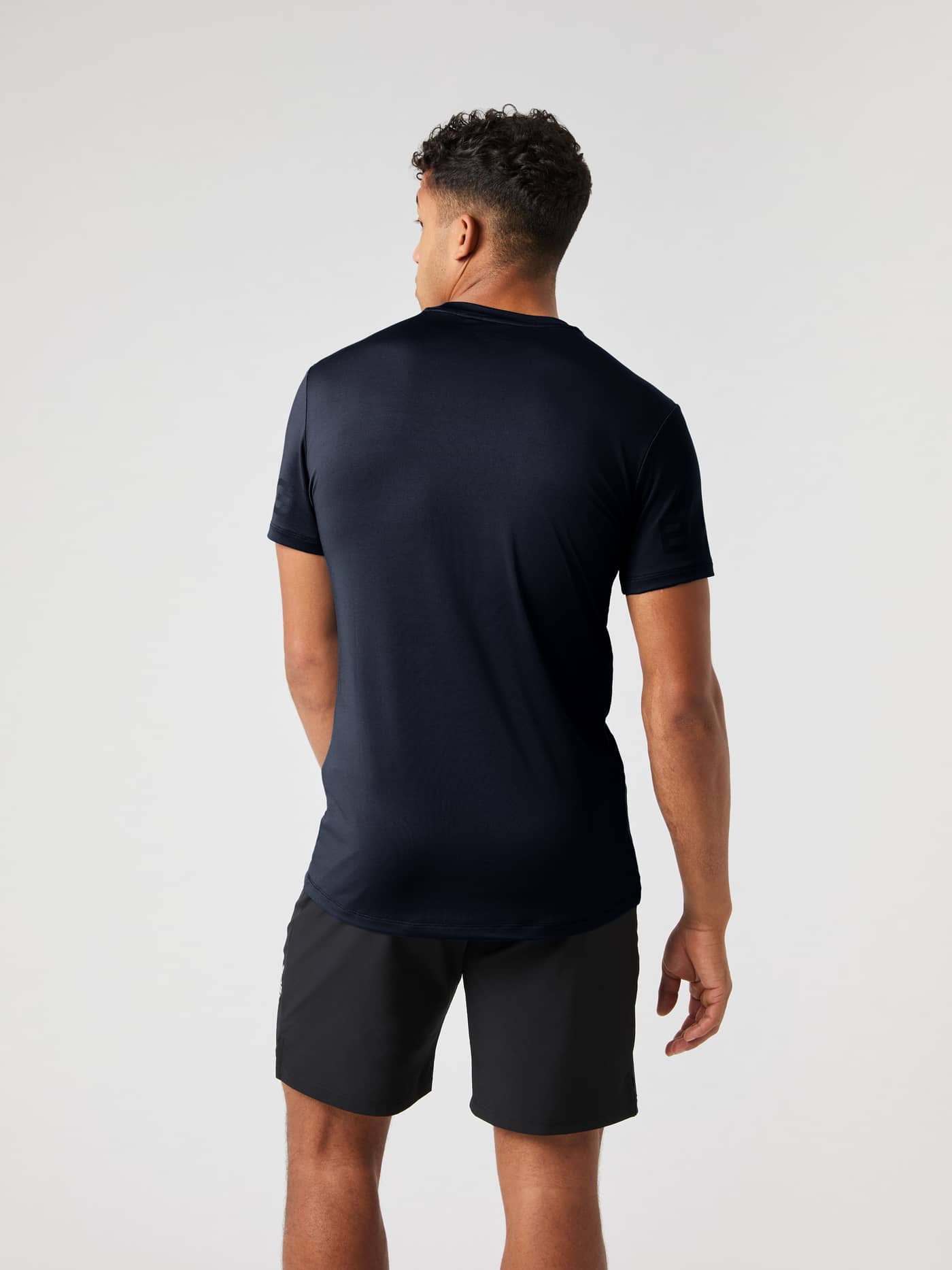 Back view of a man wearing the navy Björn Borg Borg T-Shirt. - Image 3
