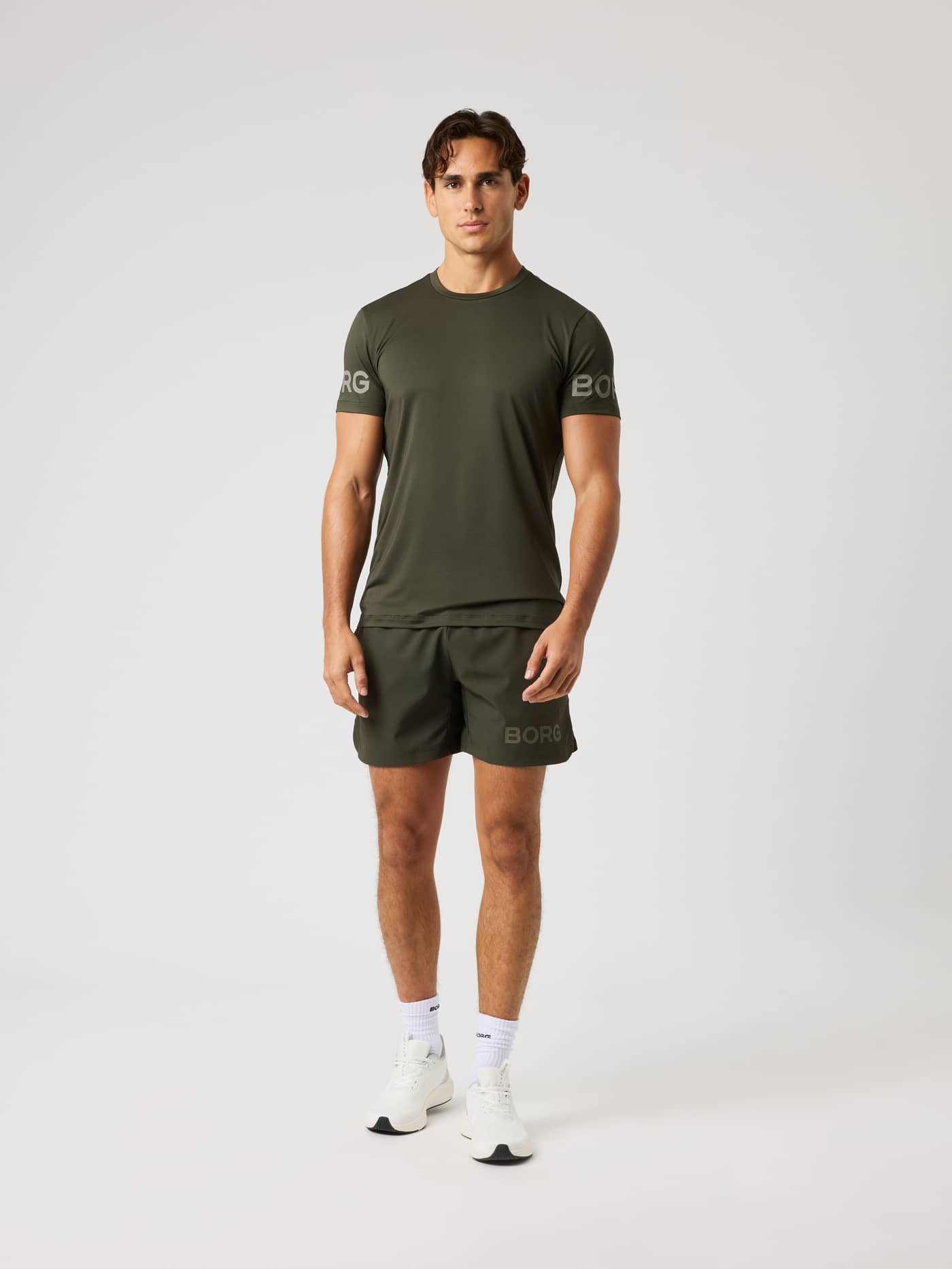 Full-body front view of the Borg T-Shirt in Rosin (Green) for training and tennis with perforated green sleeve logos. - Image 4