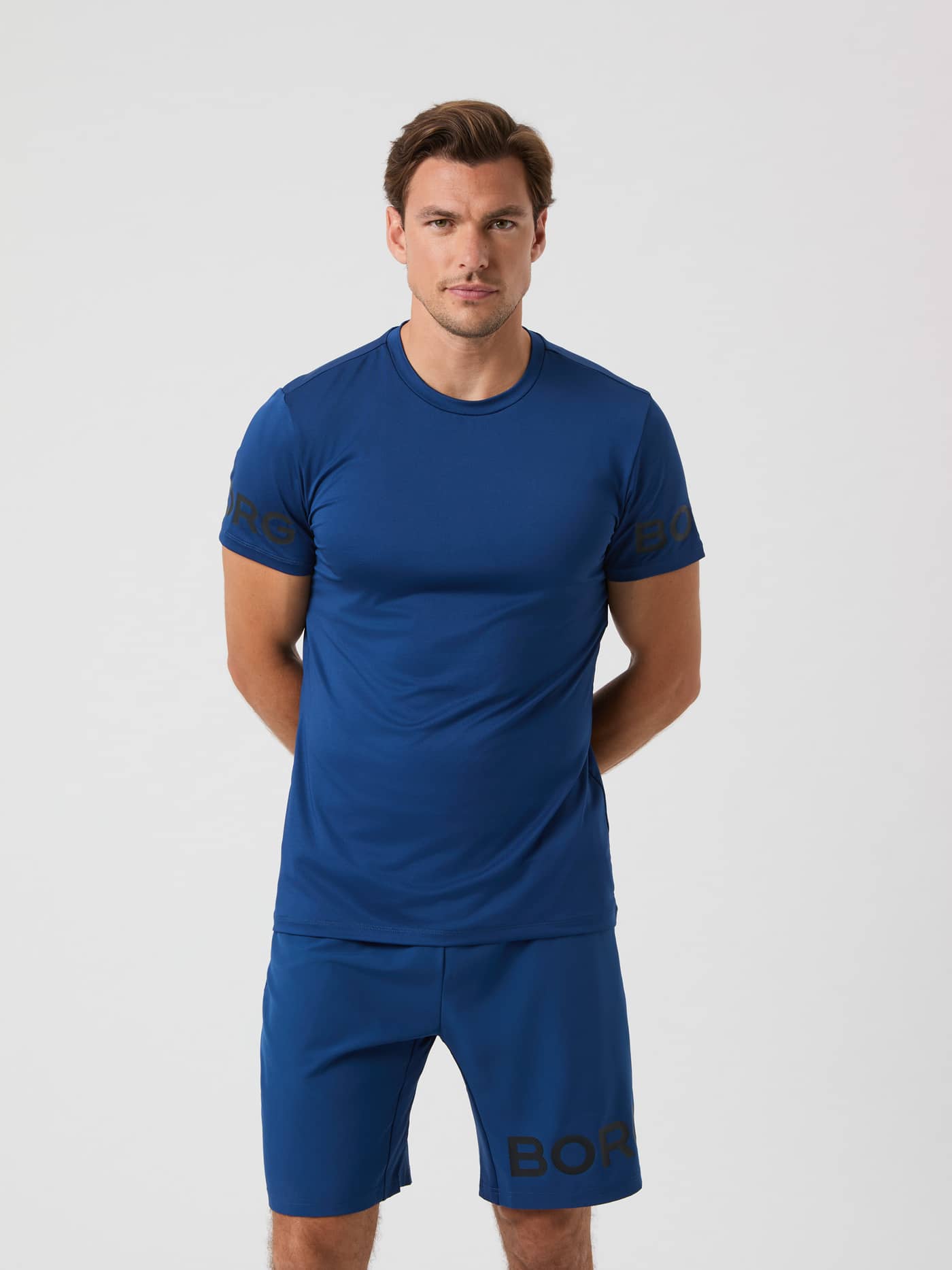 Borg T-shirt i Estate Blue (Blå) i genbrugspolyester set forfra med sort logo til mænd og træning. - Image 1