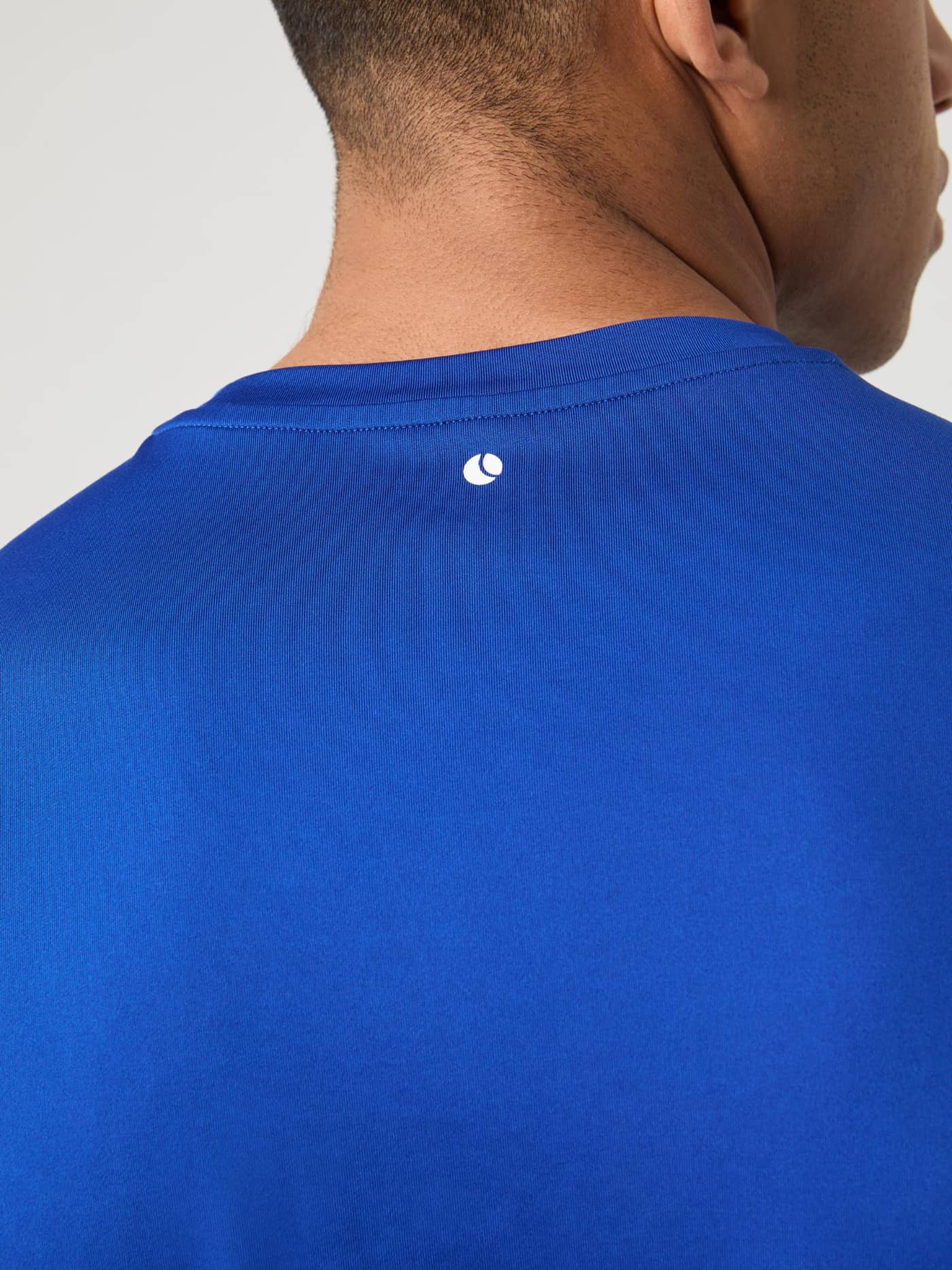 Close-up of the back of the blue Borg T-Shirt, showing the logo detail just below the neckline. - Image 5