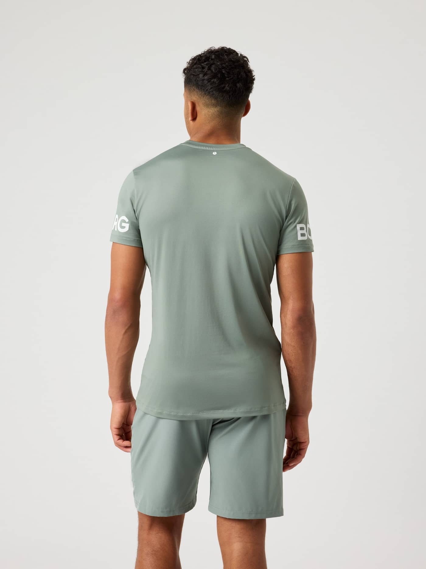 Back view of a model wearing the Björn Borg Borg T-Shirt in agave green. - Image 3