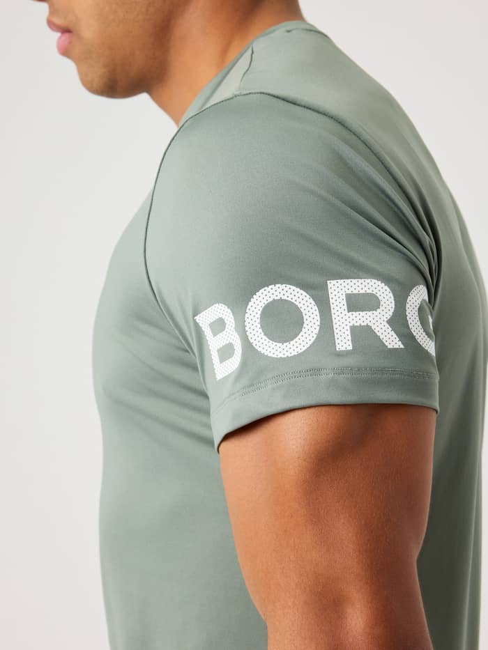 Close-up of the Borg T-shirt in Agave Green, showing the Borg logo detail on the sleeve.