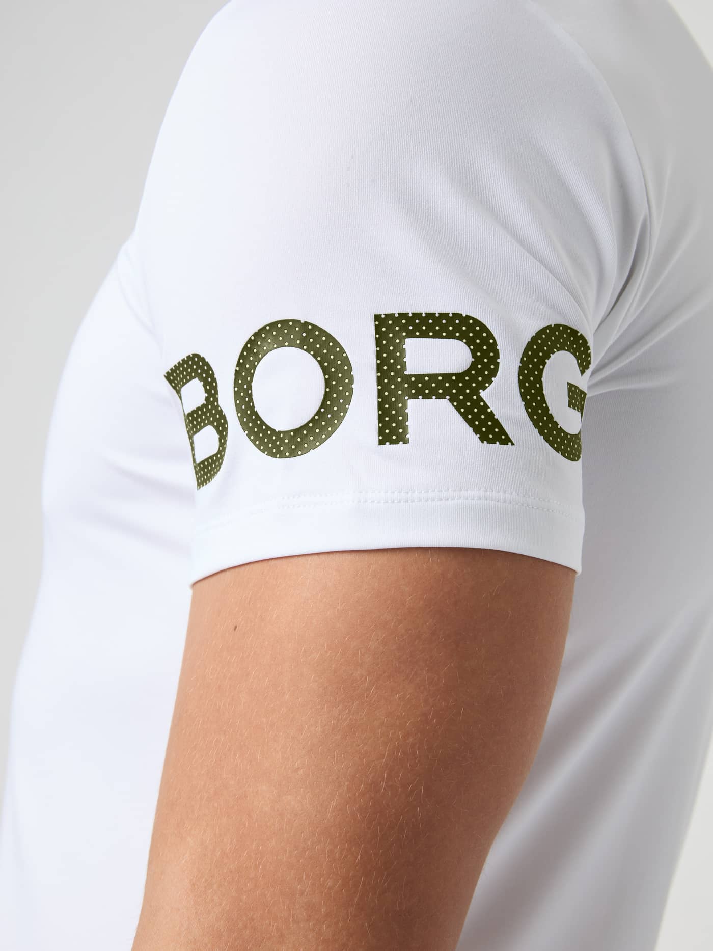 Close-up of the tennis and training Borg T-Shirt in White Green Logo (White) showing the perforated green sleeve logo. - Image 4