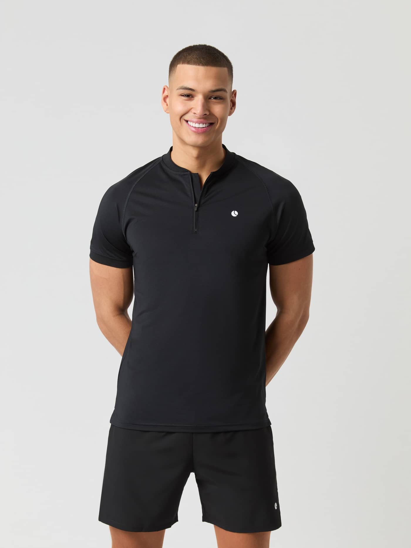 Front view of a man wearing the Björn Borg Ace Zip Polo Shirt in Black Beauty (Black), ideal for tennis performance. - Image 2