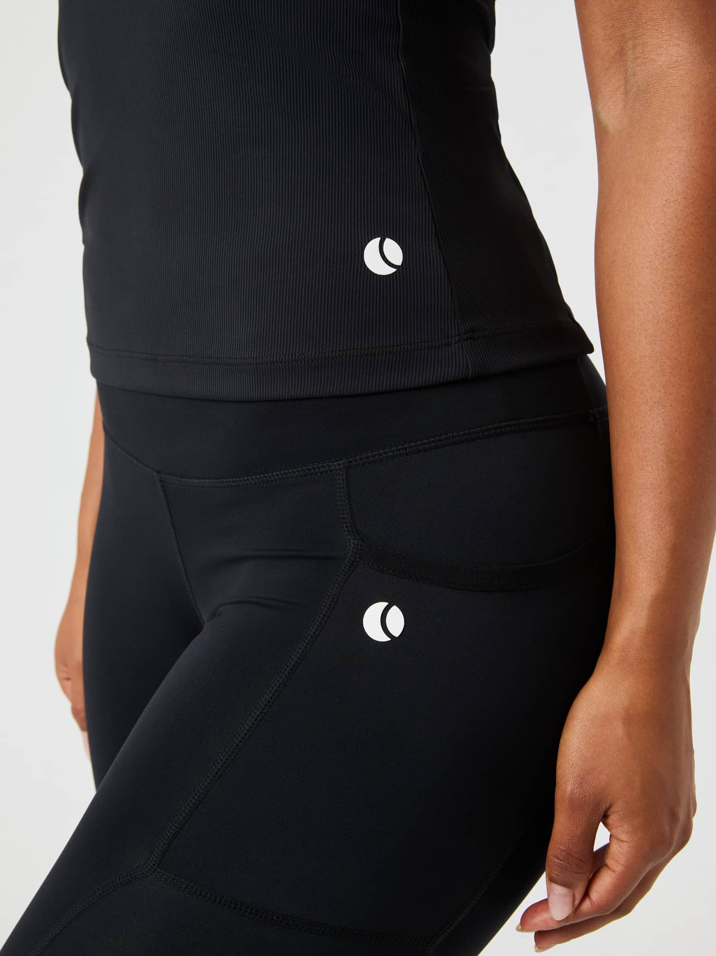 Close-up of the black Björn Borg Ace Pocket Ribbed Tank Top, showing the ribbed fabric and logo detail. - Image 6