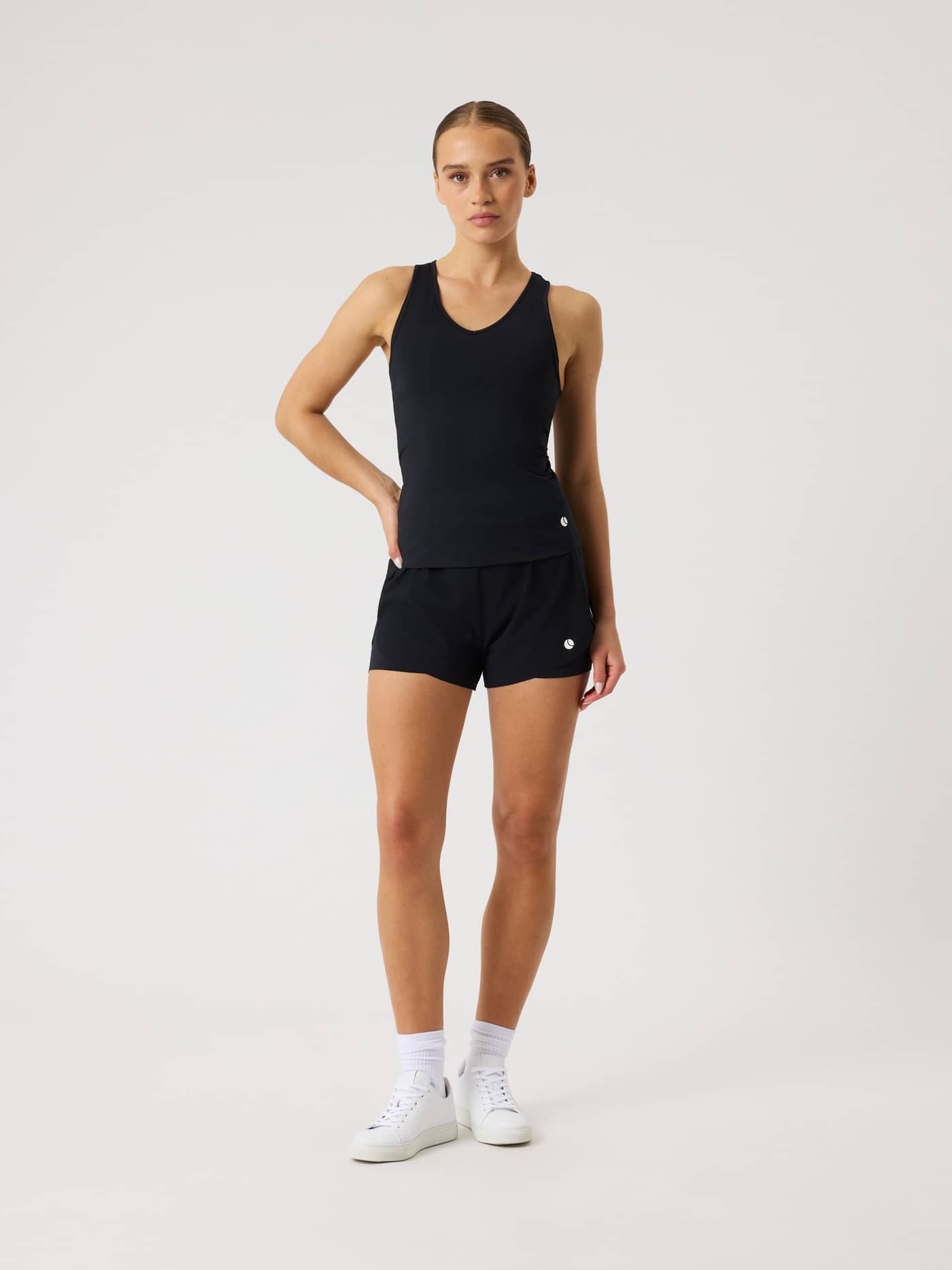 Full-body front view of a model wearing the Björn Borg Ace V Neck Tank Top in Black Beauty (Black) for tennis performance. - Image 3