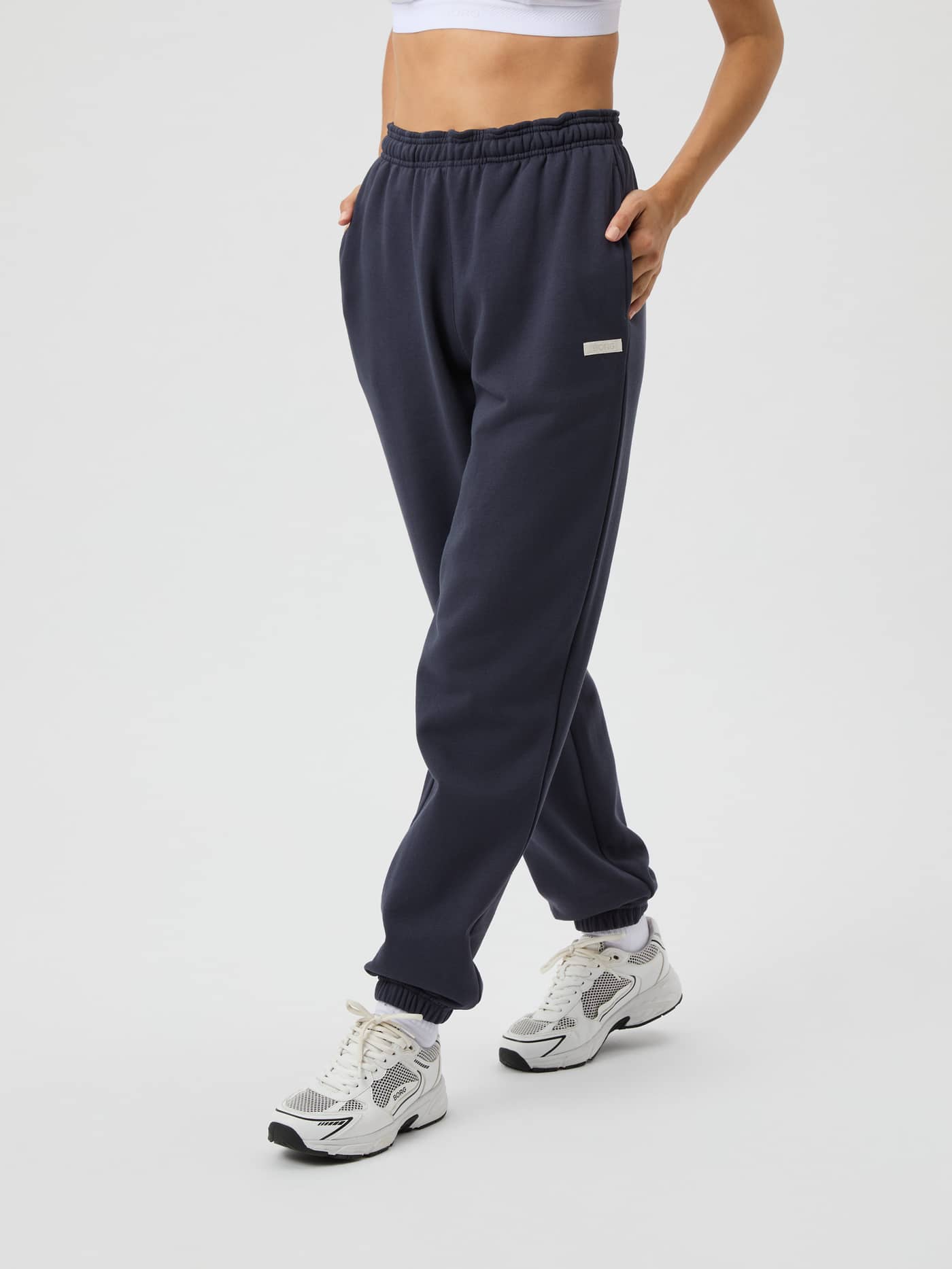 Studio Oversized Sweatpants in Odyssey Gray (Grey) for women, featuring a high-waisted relaxed fit and white logo label. - Image 2