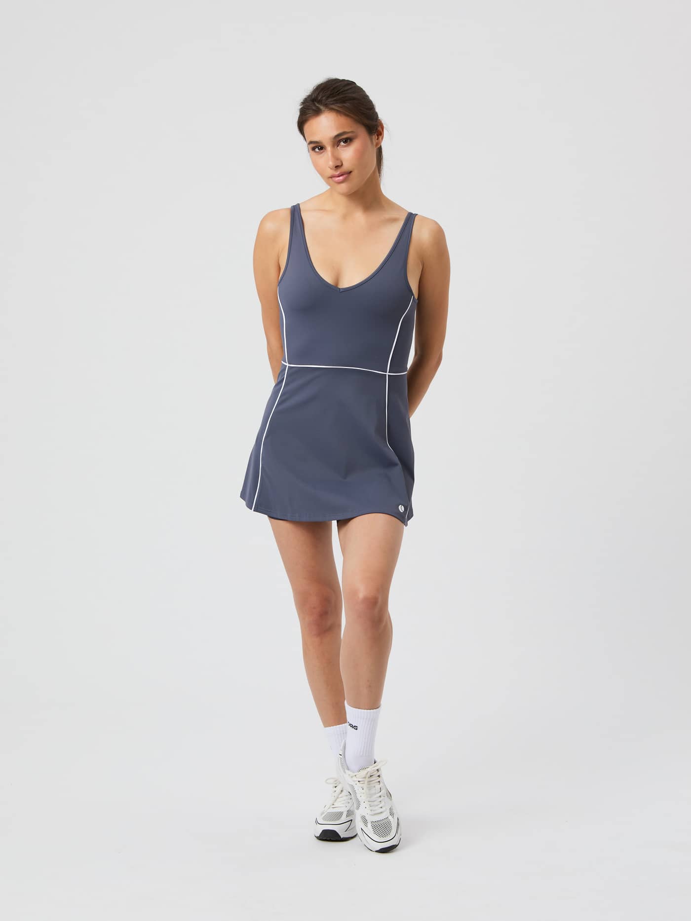 Full-body front view of a model in the Odyssey Gray (Grey) Björn Borg Ace V Dress, a stylish performance tennis dress. - Image 3