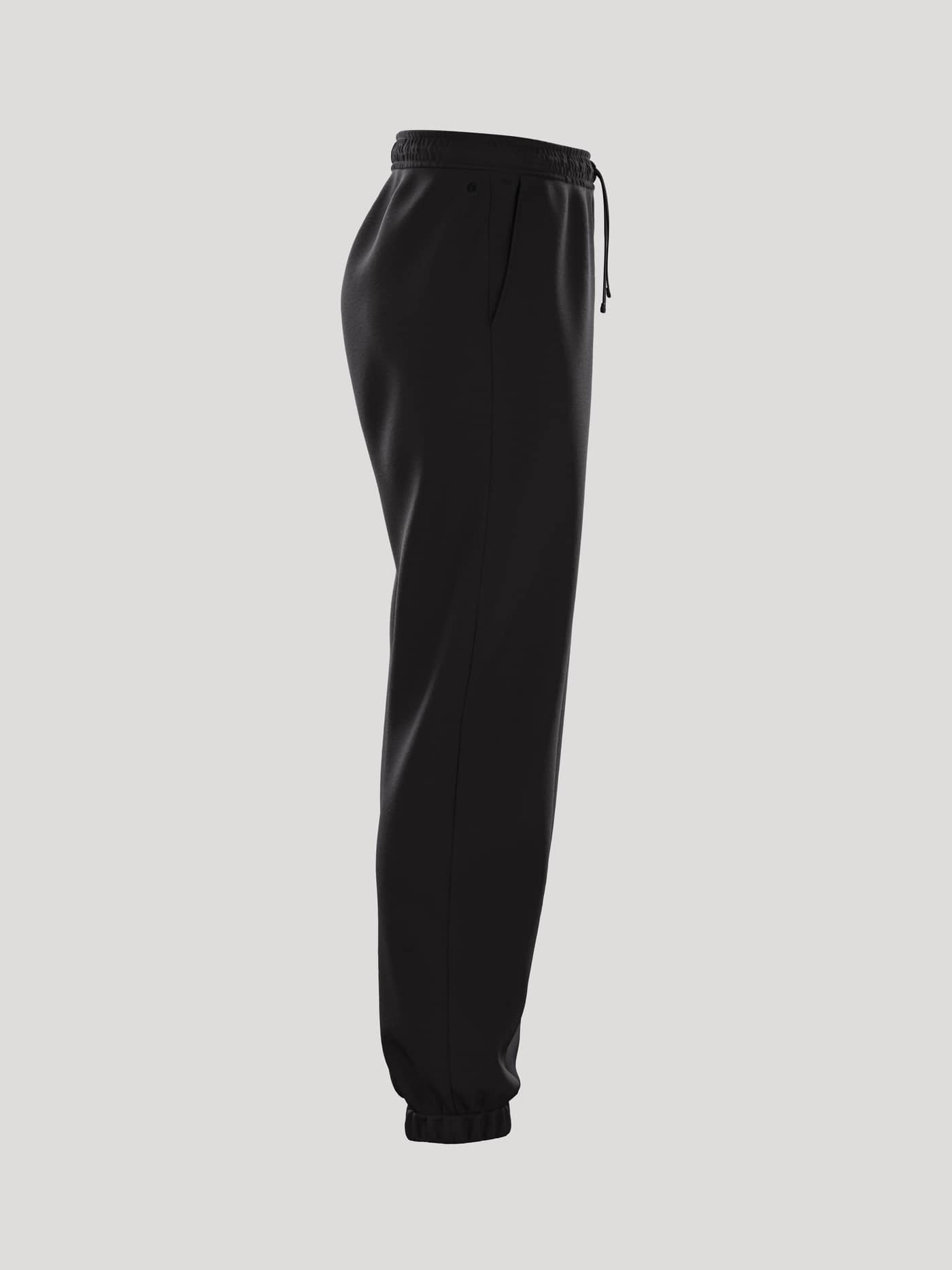 Zij-aanzicht van de Borg Essential 1 Sweatpants voor dames in Black Beauty (Zwart) met losse pasvorm en elastische boorden. - Image 3