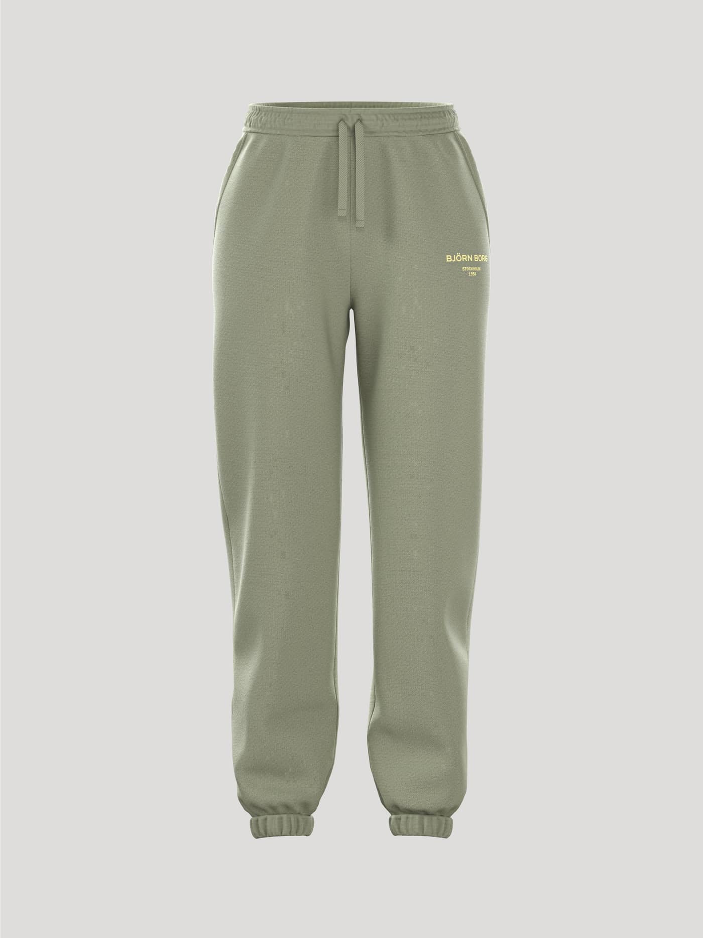 Front view of the women's Borg Essential 1 Sweatpants in tea green. - Image 1