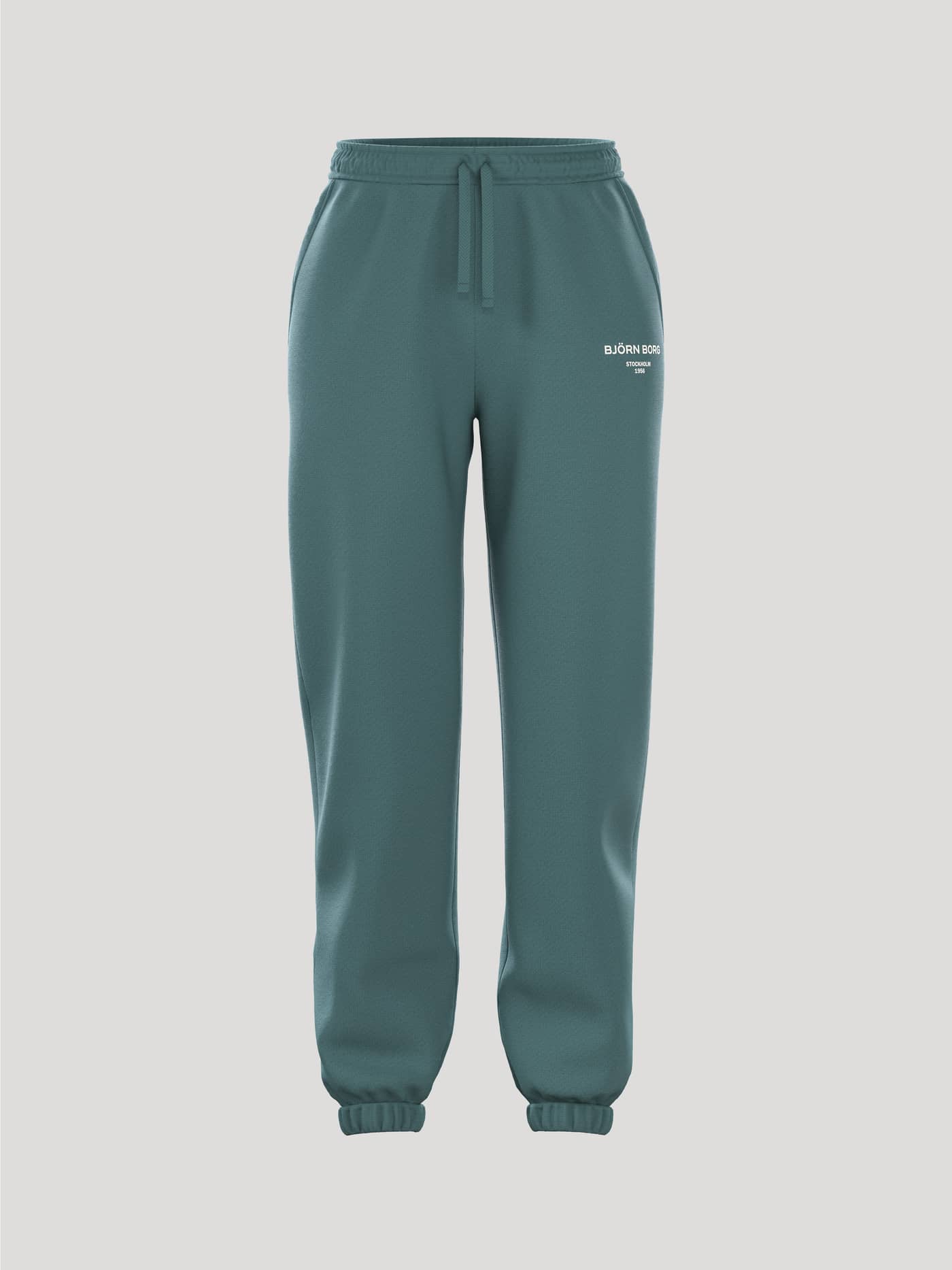 Borg Essential 1 Sweatpants i Sea Pine (Grønn) sett forfra, stilig joggebukse til dame med hvit logo og behagelig passform. - Image 1