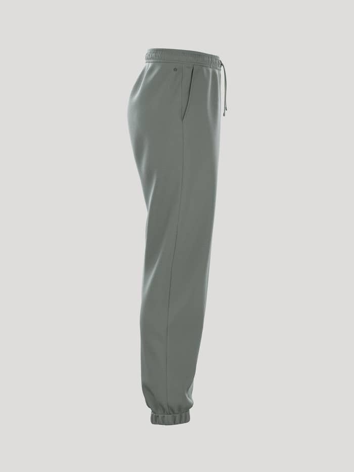 Borg Essential 1 Sweatpants i Agave Green (Grøn) set fra siden med en løs pasform og ribbede manchetter. - Image 2
