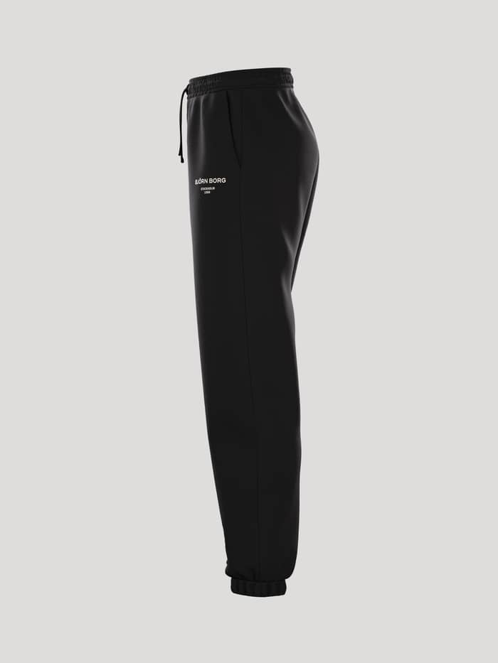 Borg Essential 1 Sweatpants i Black Beauty (Sort) set fra siden med en løs pasform og et behageligt fit. - Image 4