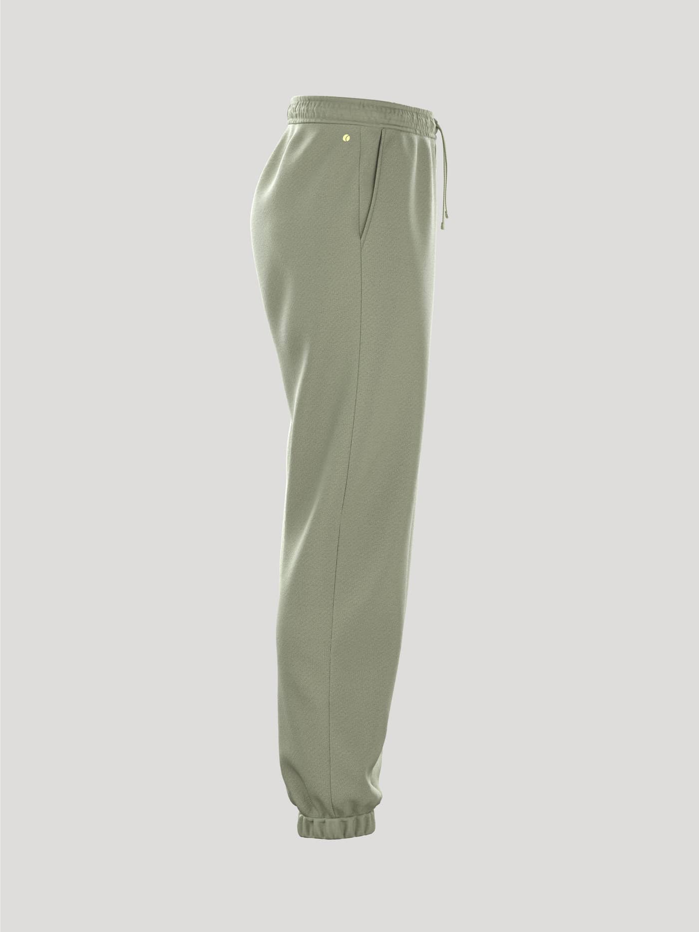 Side view of the women's Borg Essential 1 Sweatpants in tea, featuring a loose fit, drawstring waist, and cuffed ankles. - Image 3