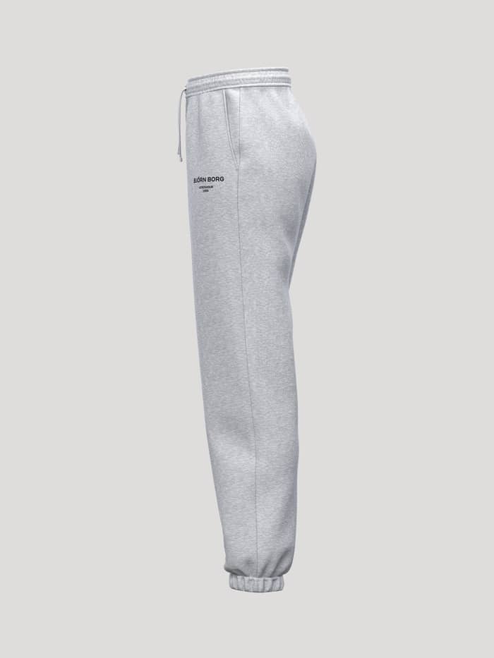 Zijaanzicht van de Borg Essential 1 Sweatpants in Light Grey Melange (Grijs) met geribde boorden en een zwart logo. - Image 3