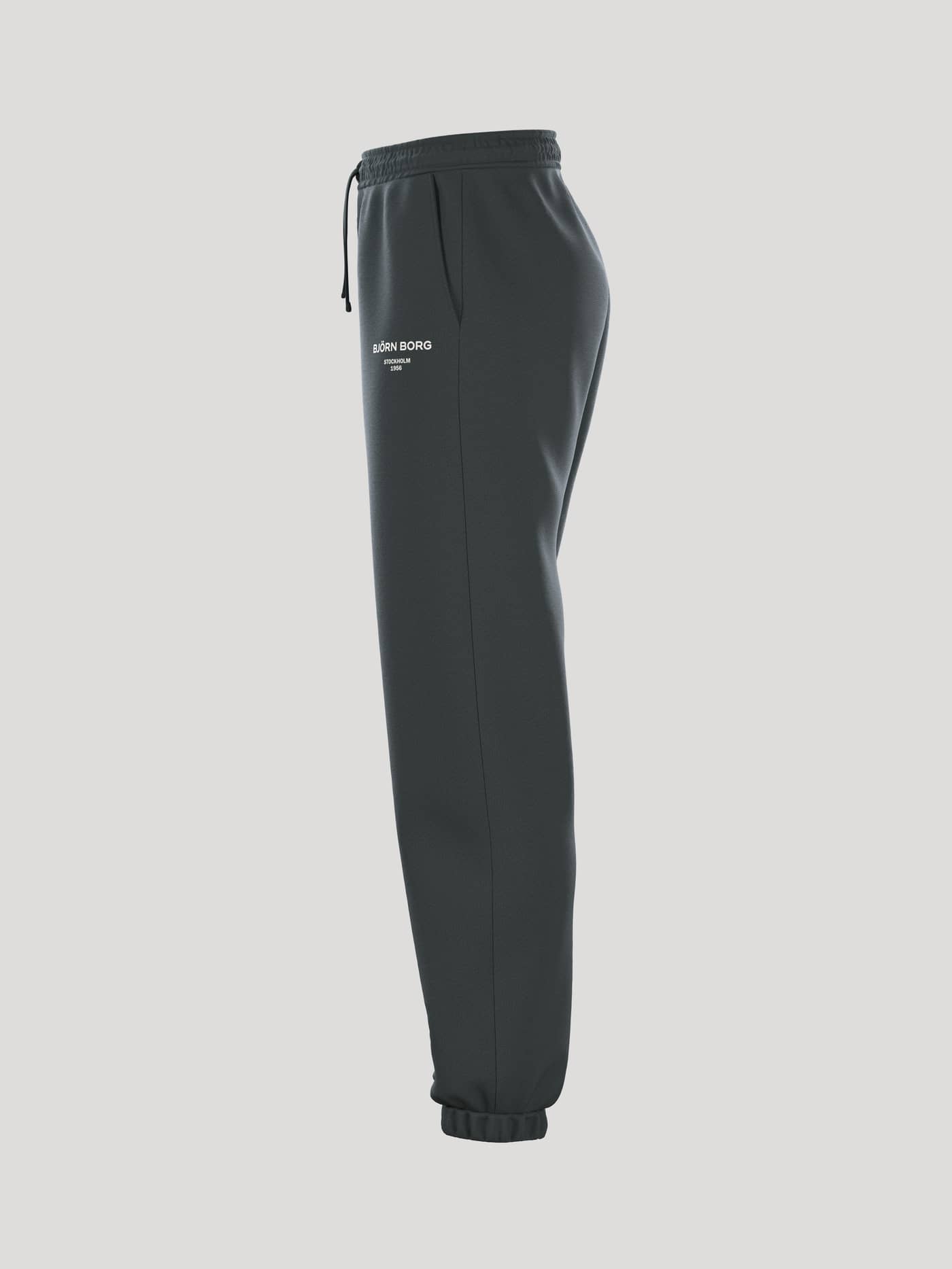 Vista lateral de los Borg Essential 1 Sweatpants para mujer en Urban Chic (Verde) con ajuste holgado y logo blanco. - Image 4