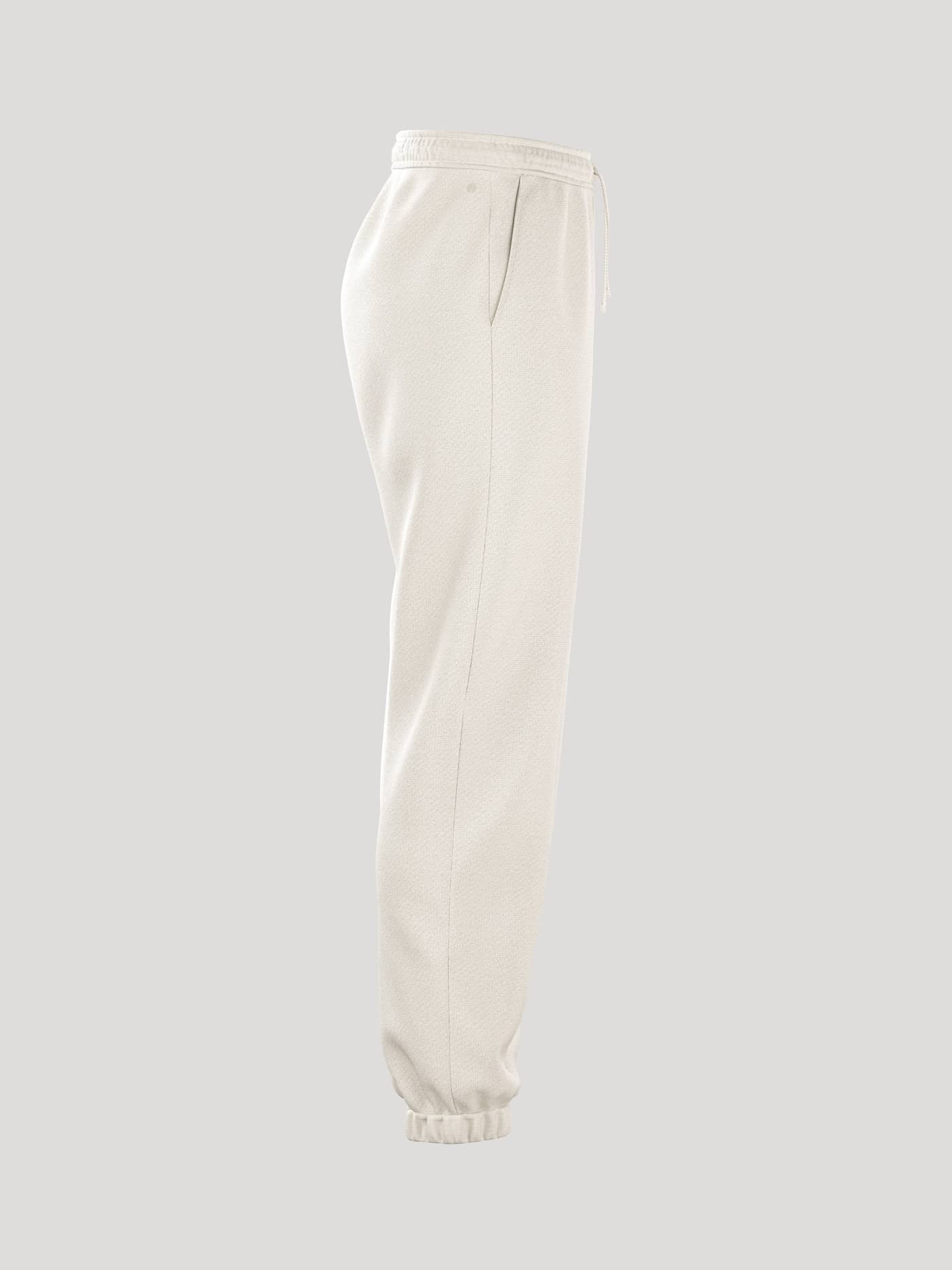 Side view of the women's Borg Essential 1 Sweatpants in Tofu. - Image 3