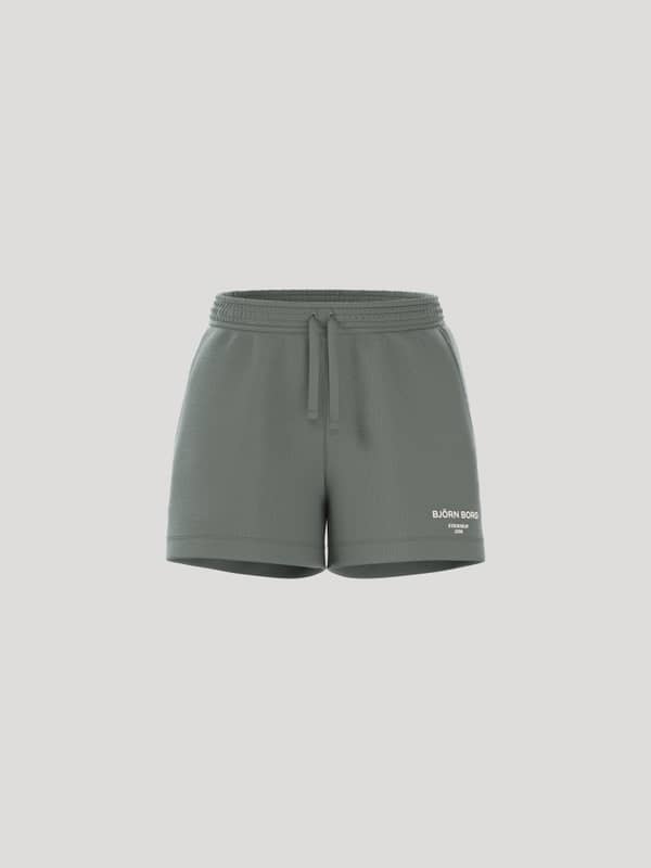 Front view of the Borg Essential 1 Sweatshorts in Agave Green (Green) featuring a loose fit and white logo detail.