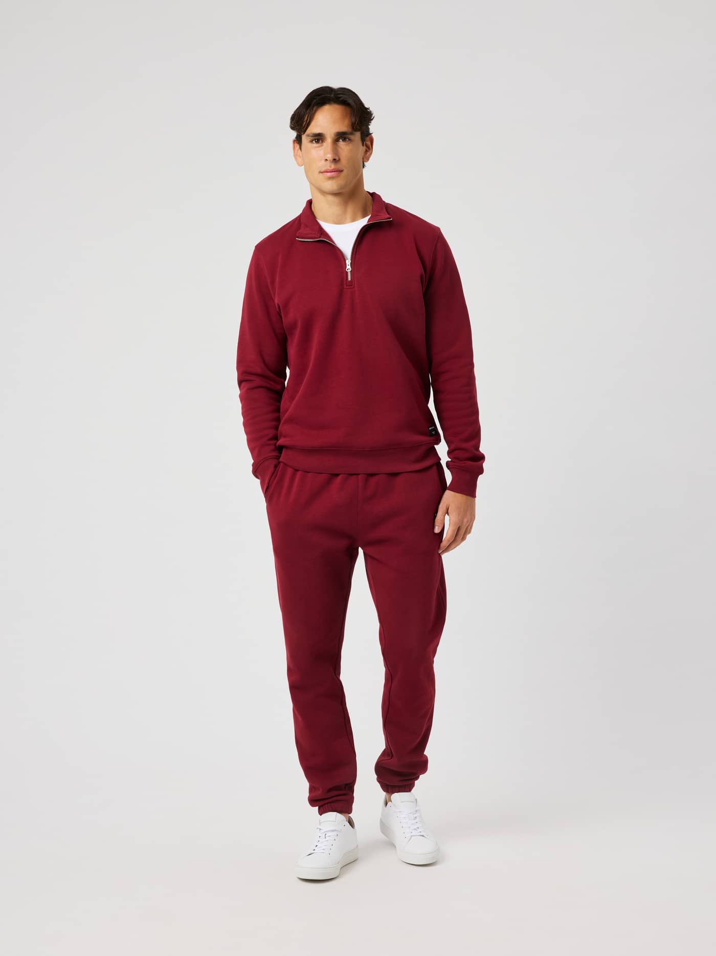 Front view of the Centre Half Zip in Cabernet (Red) worn by a model. - Image 4