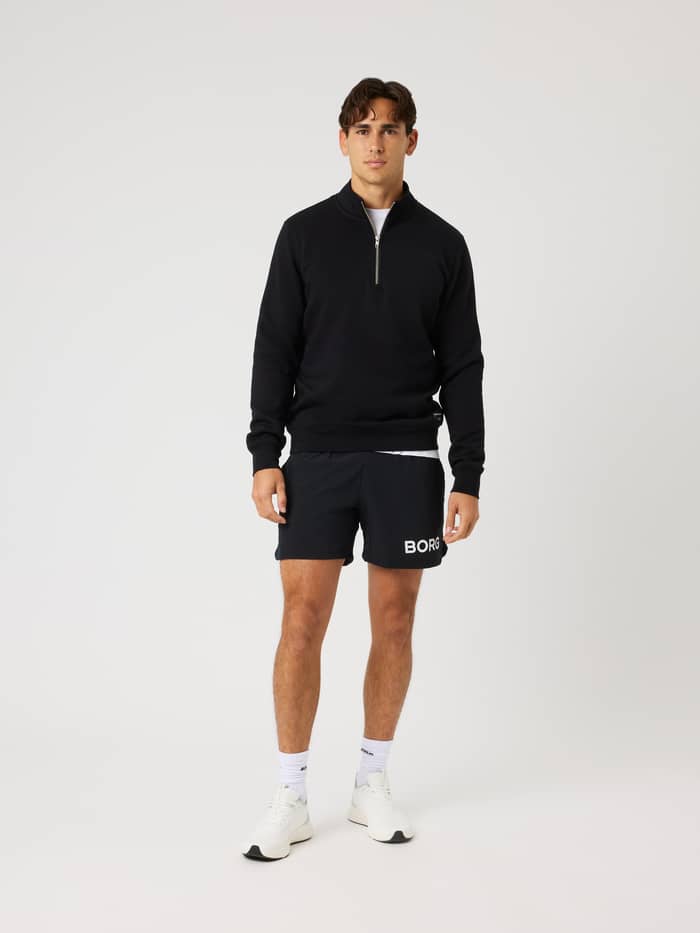 Volledig vooraanzicht van de Centre Half Zip in Black Beauty (Zwart), een trui met een comfortabele normale pasvorm. - Image 3
