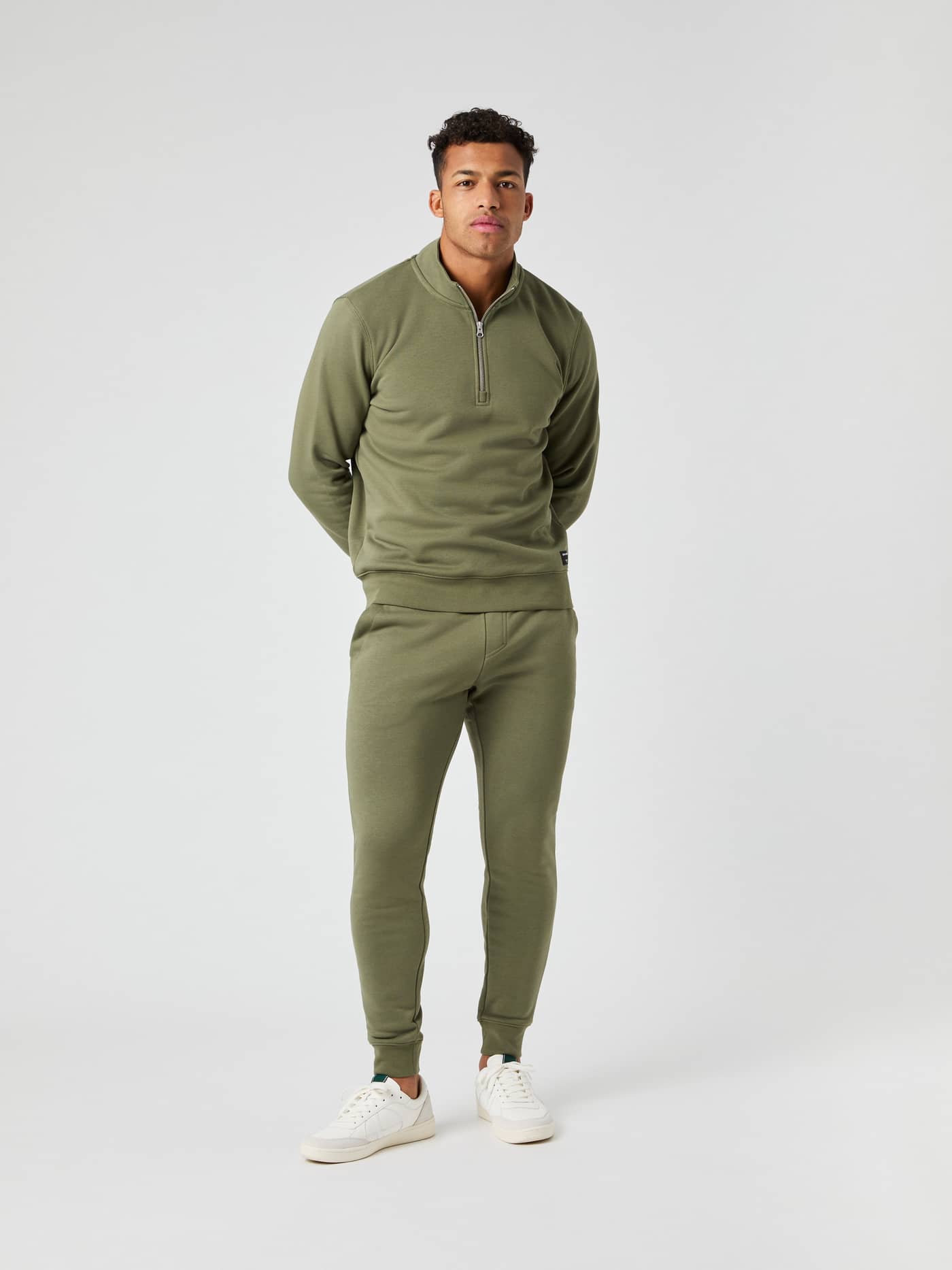 Model seen from the front wearing the Björn Borg Centre Half Zip sweater in Dusty Olive with matching sweatpants. - Image 3