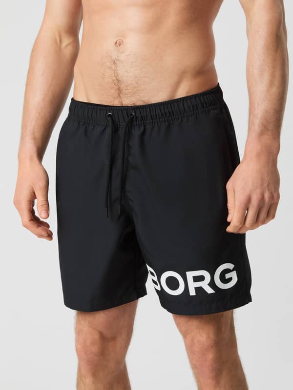 Vue de face du Borg Swim Shorts en Black Beauty (Noir), un short de bain à séchage rapide avec logo blanc.