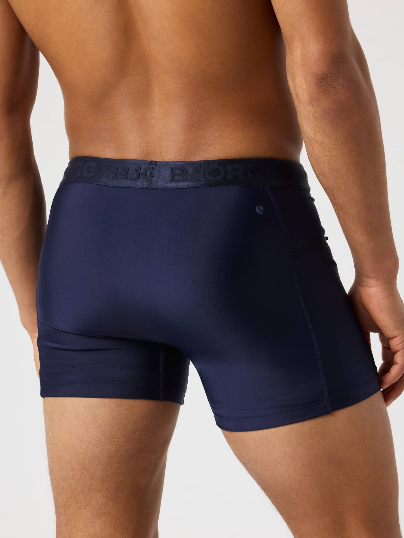 Back view of slim fit Borg Stretch Swim Shorts in Night sky (Navy) with a functional branded waistband and tennis print. - Image 2