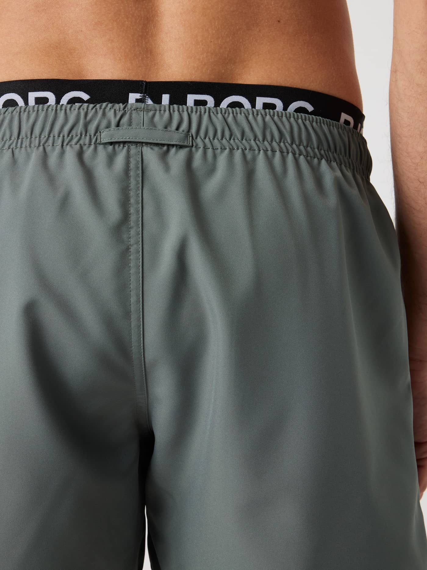 Borg Elastic Swim Shorts i Balsam Green (Grøn) set bagfra med hvidt logo på elastik i taljen og løkke. - Image 4