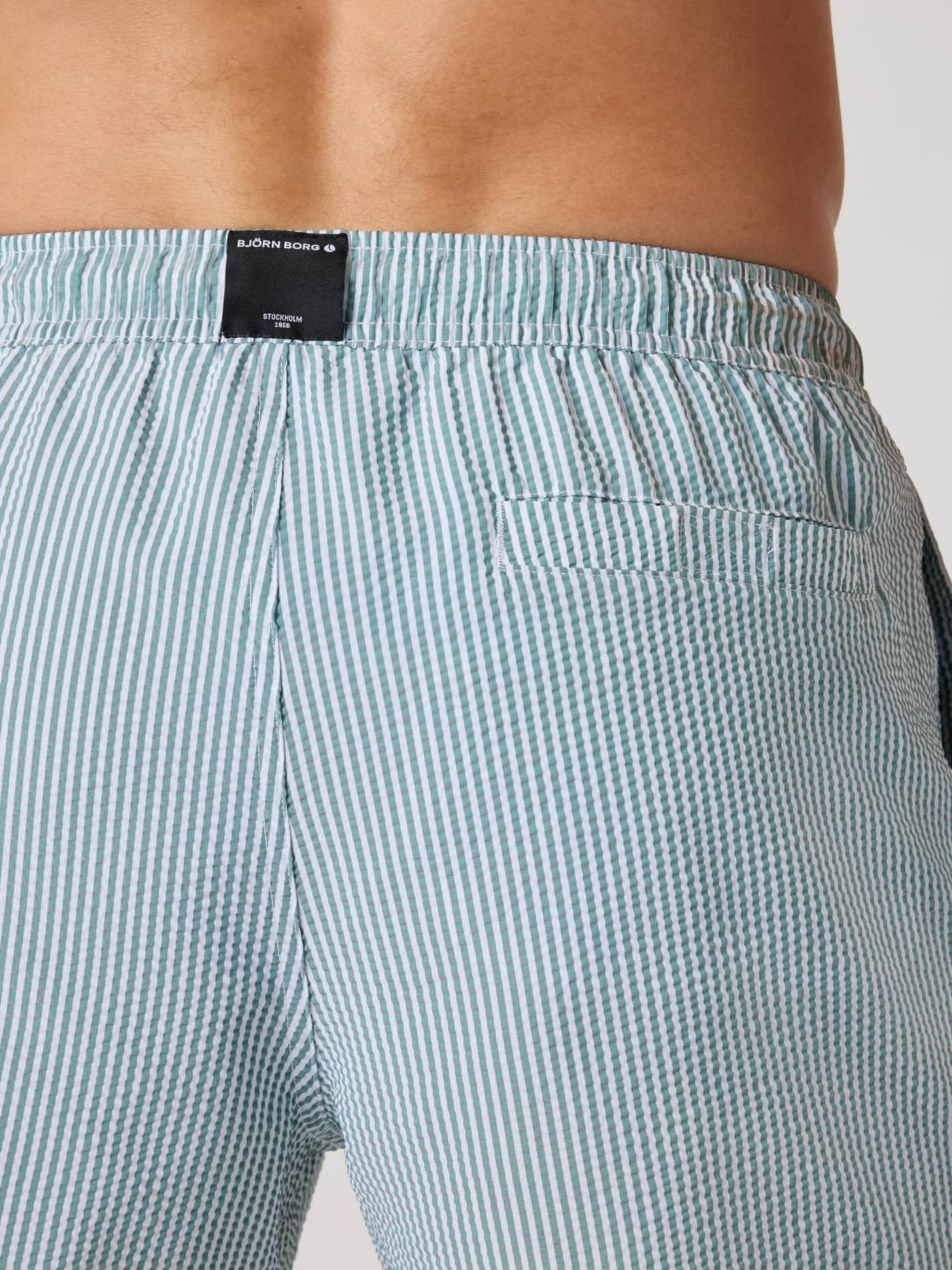 Detailed back view of the Borg Seersucker Swim Shorts in Searstripe 5 (Blue) showing the striped pattern and black logo. - Image 4