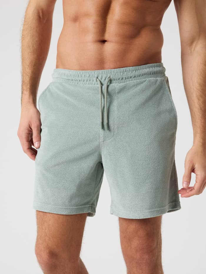 Front view of a man wearing Björn Borg Toweling Pool Shorts in Slate Gray (Green) with a regular fit and side pockets.