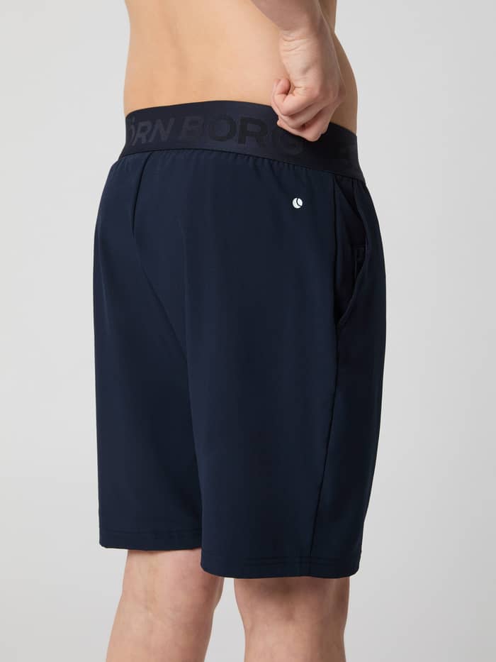 Seitenansicht der Björn Borg Shorts für kids in Night Sky (Marineblau) zum Training mit elastischem Markenbund. - Image 3
