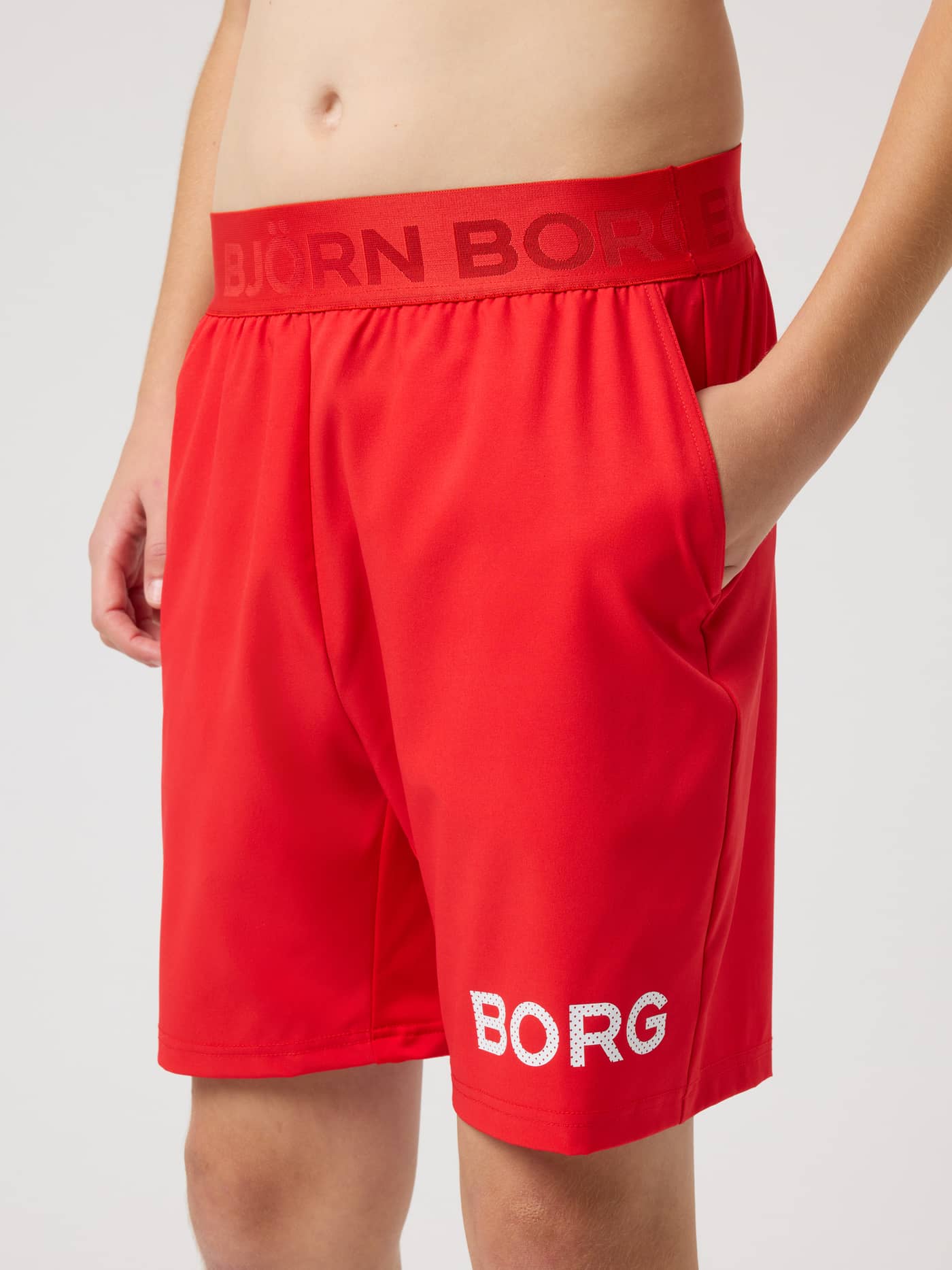 Borg Shorts for kids in Flame Scarlet (Red) featuring a white leg logo and branded waistband for training. - Image 2