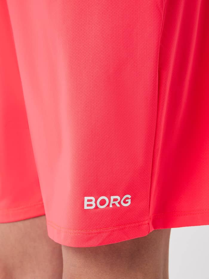 Close-up of the white BORG logo on Diva Pink (Pink) Borg Soft Shorts for kids, designed for active training. - Image 4