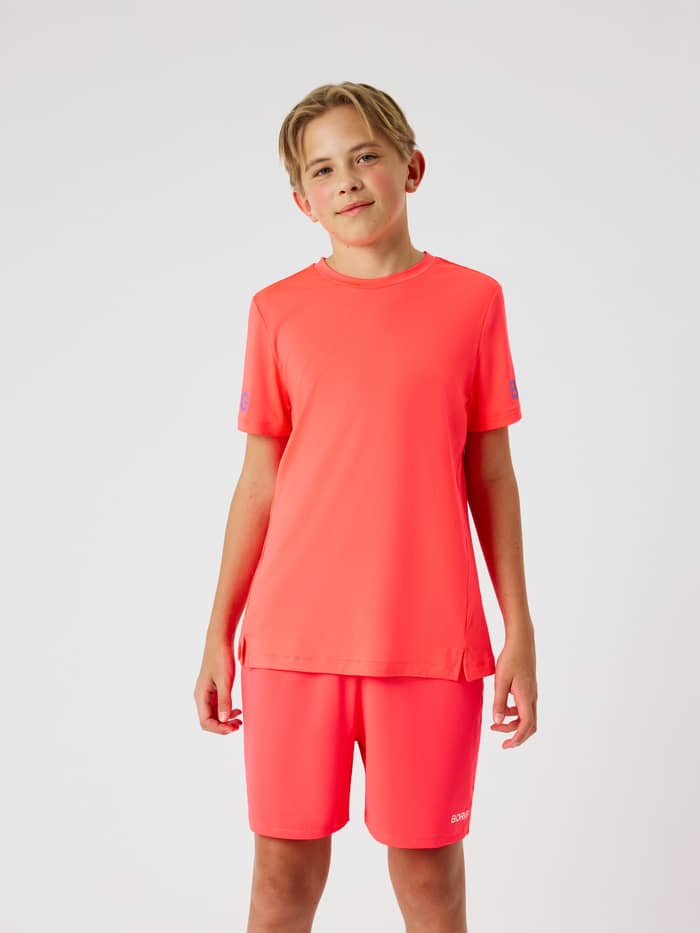 Borg T-Shirt til børn i Diva Pink (Lyserød) set forfra med lilla logoer til træning. - Image 4