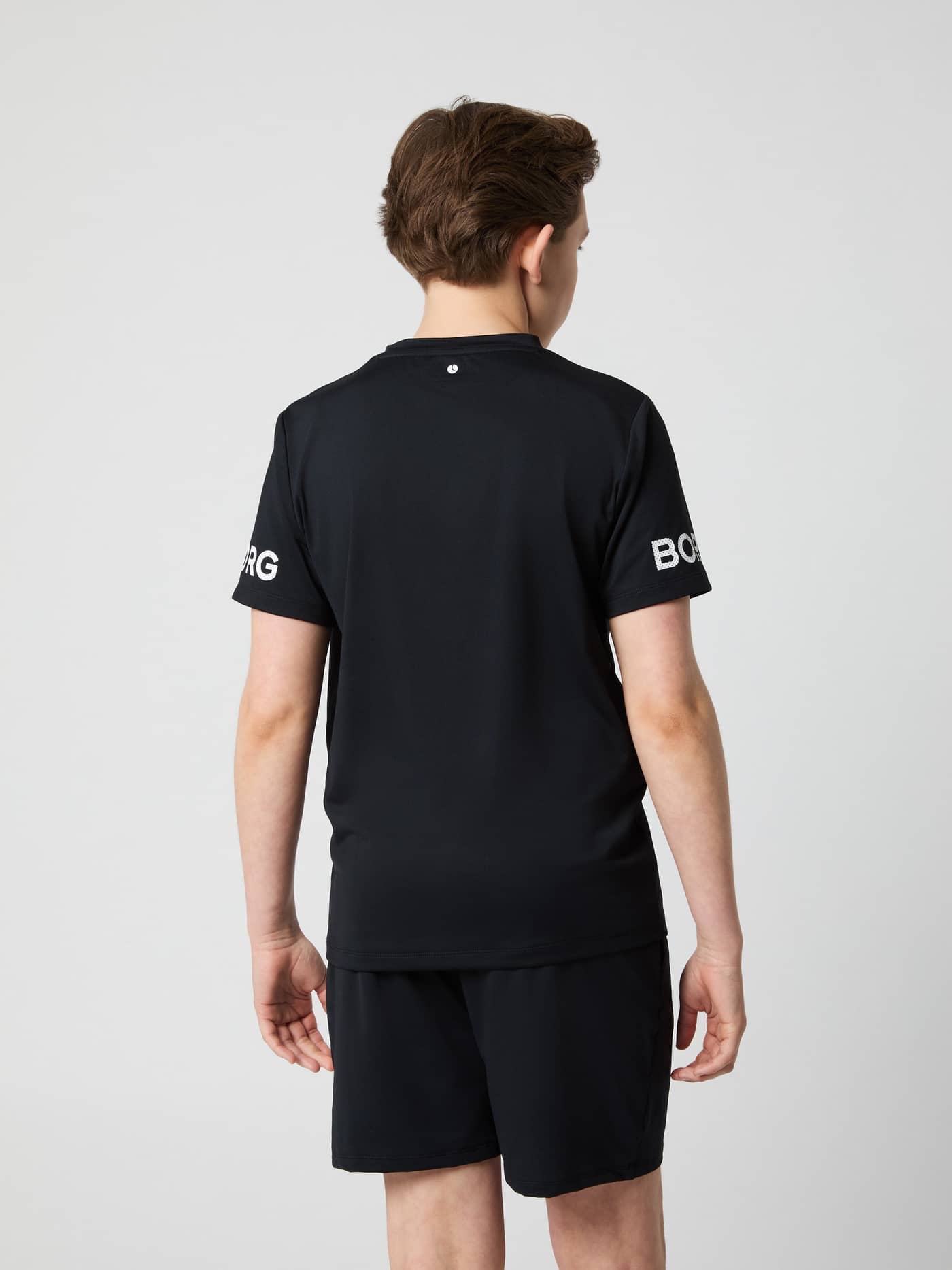 Borg T-Shirt til børn i Black Beauty (Sort) set bagfra med hvide logoer på ærmerne til træning. - Image 2