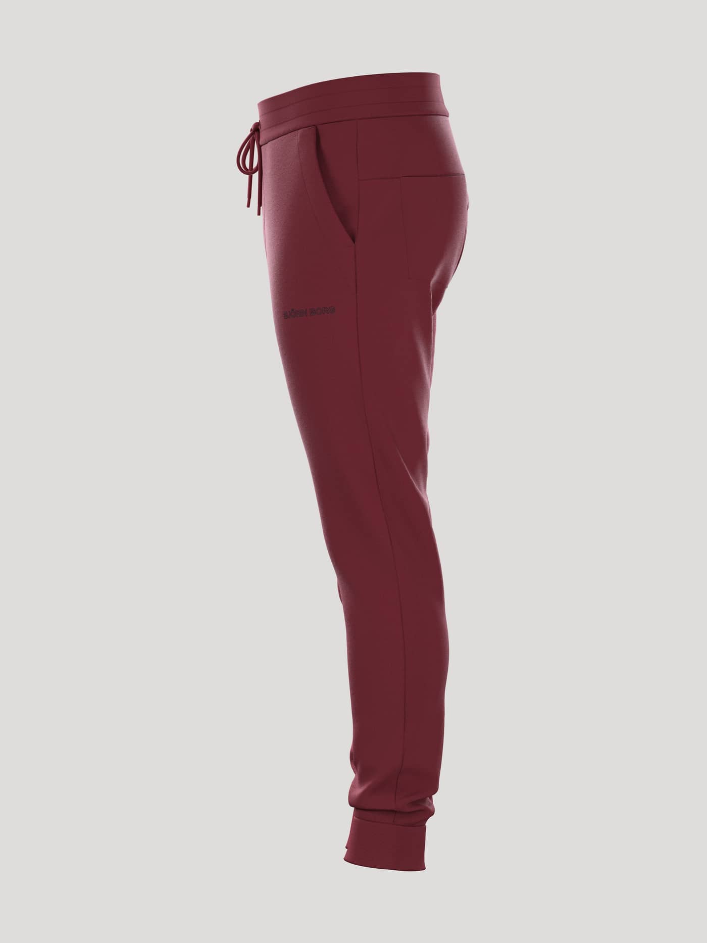 Seitenansicht der Borg Essential 3 Sweatpants in Pomegranate (Rot) mit funktioneller Seitentasche und bequemer Passform. - Image 4