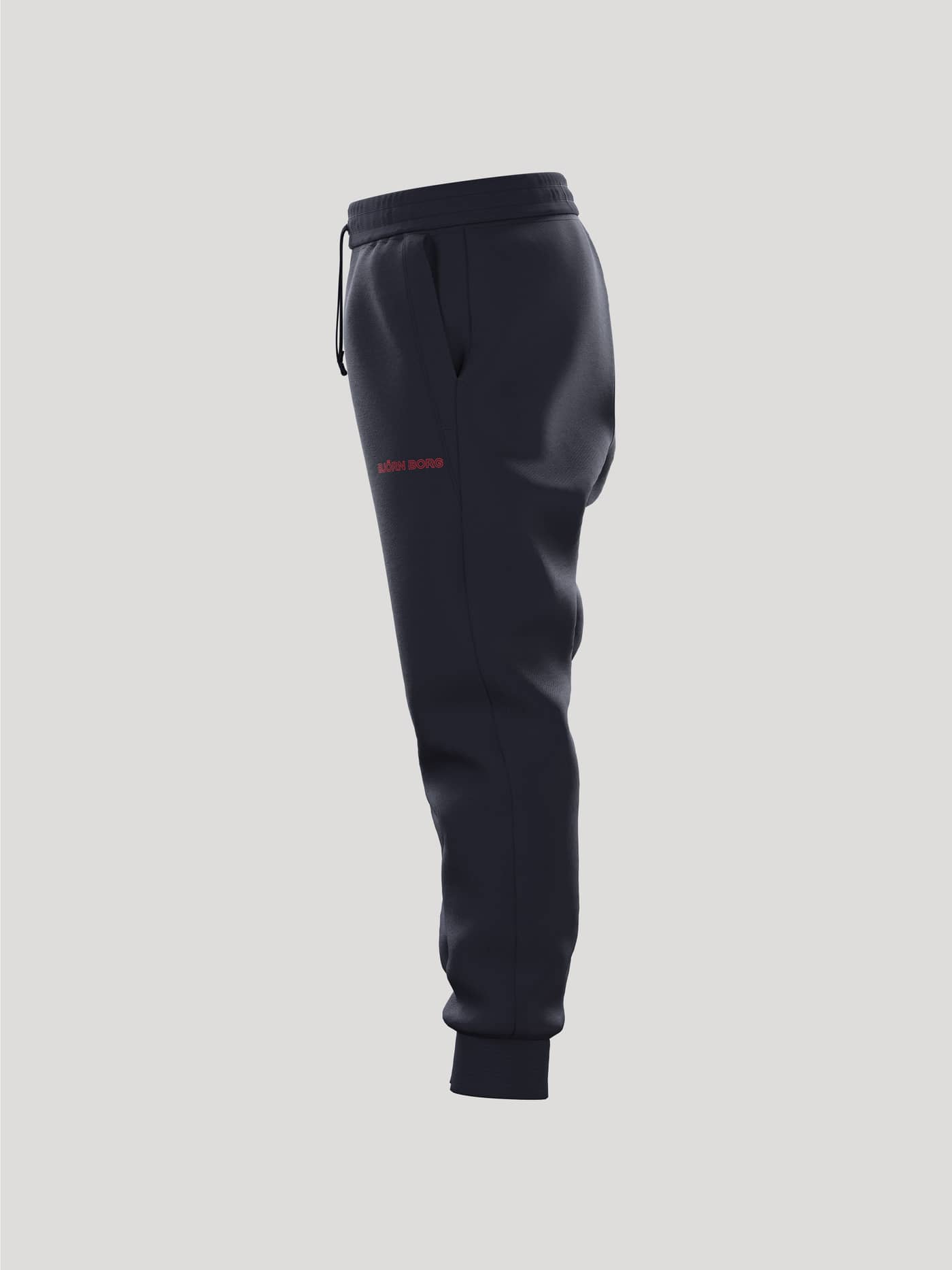 Zijaanzicht van de Borg Essential 3 Sweatpants voor kinderen in Night sky (Marineblauw) met rood logo en geribde boorden. - Image 4