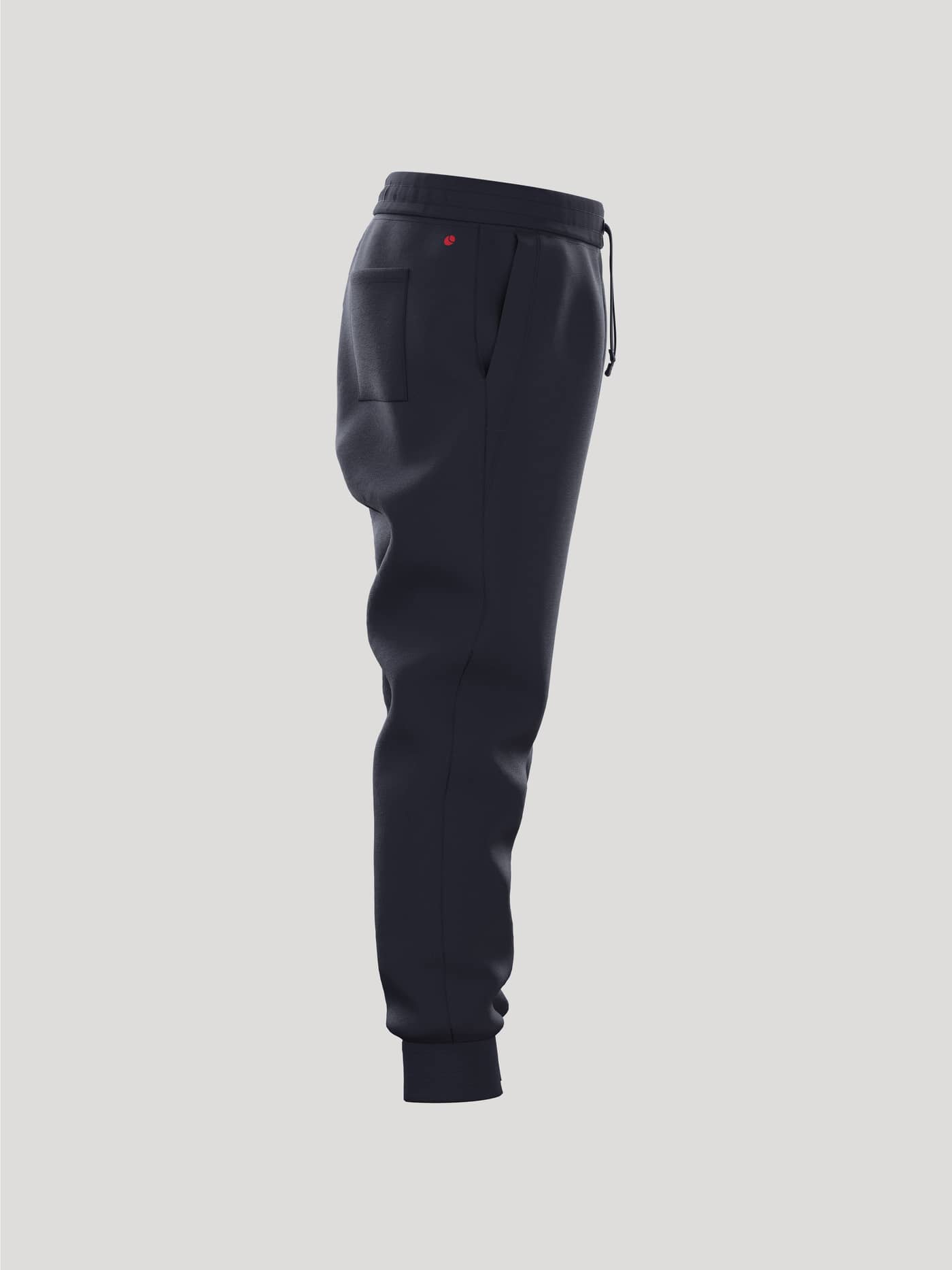 Zij-aanzicht van de Borg Essential 3 Sweatpants voor kids in Night sky (Marineblauw) met klein rood logo en geribde boorden. - Image 2