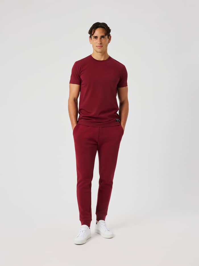 Front view of the Centre Tapered Sweatpants in Cabernet, featuring a drawstring waist and tapered legs.