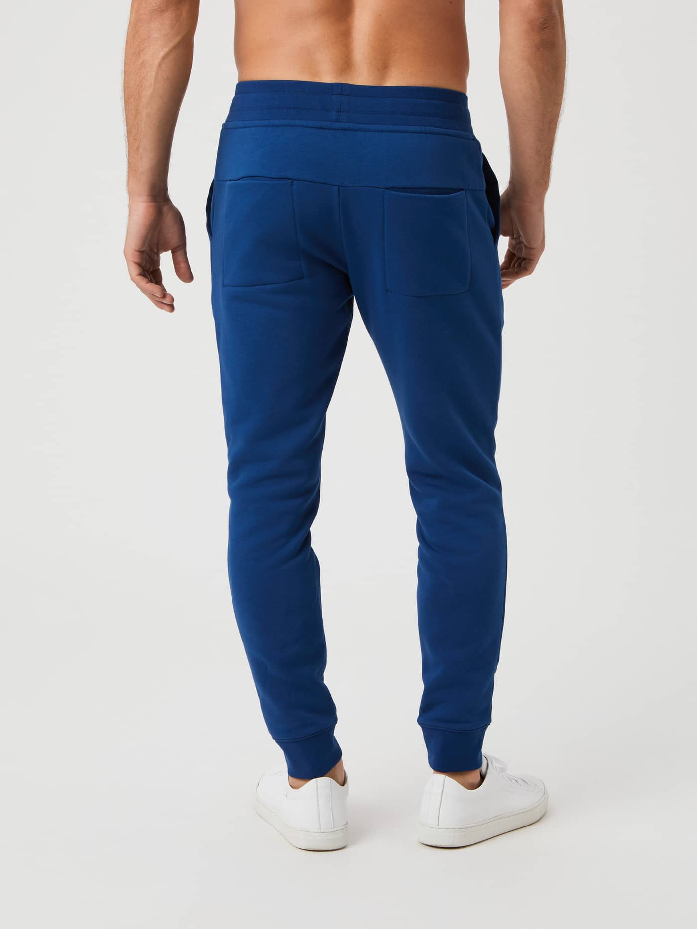 Back view of a model wearing Björn Borg Centre Tapered Sweatpants in Estate Blue. - Image 2