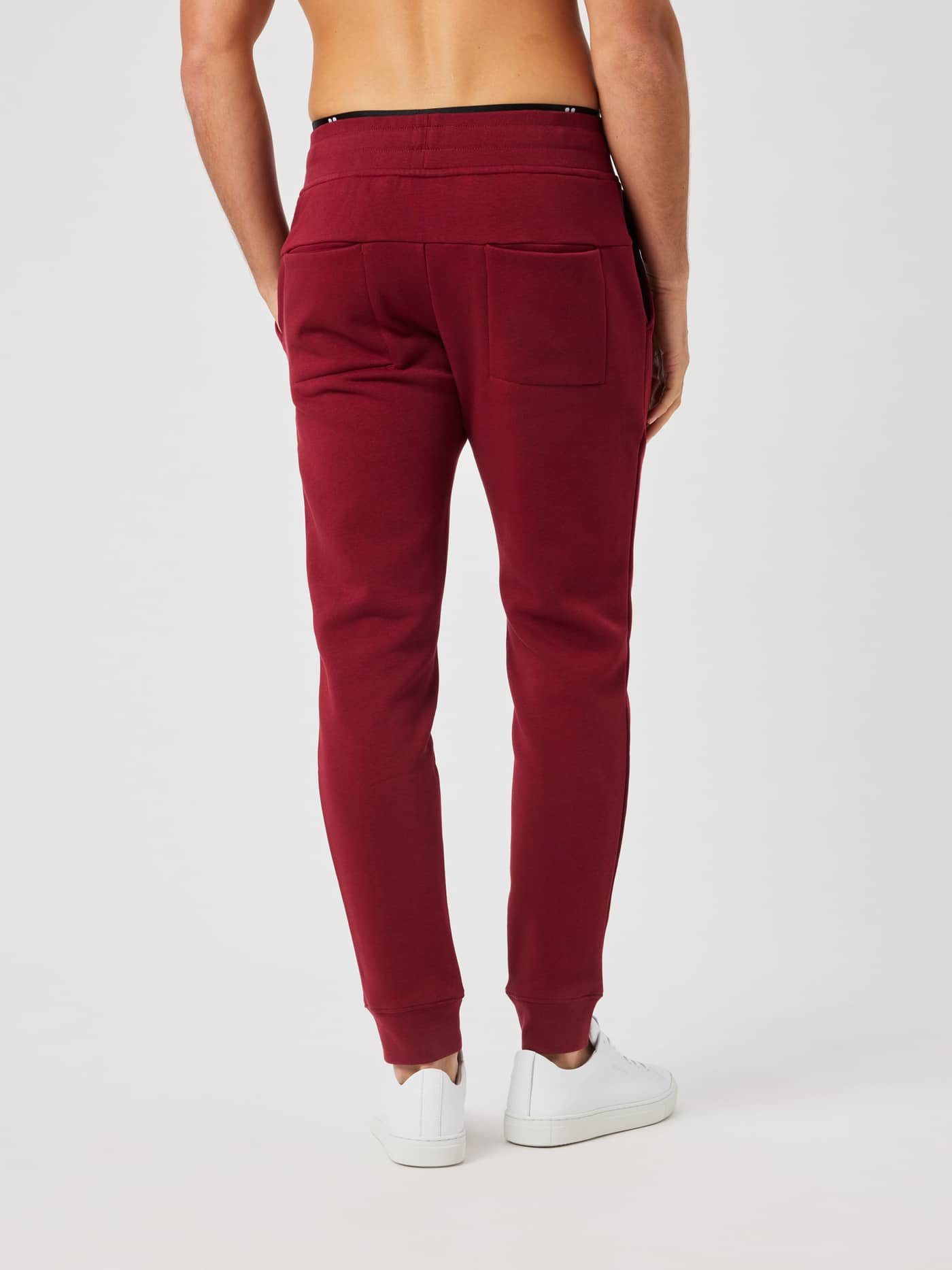 Back view of the Centre Tapered Sweatpants in Cabernet with back pockets and elastic waistband. - Image 2