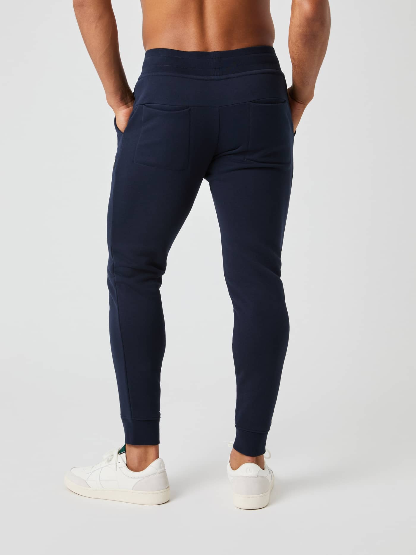 Back view of a model wearing the Björn Borg Centre Tapered Sweatpants in navy. - Image 2