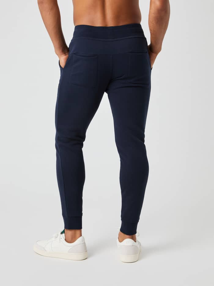 Back view of a model wearing the Björn Borg Centre Tapered Sweatpants in navy.
