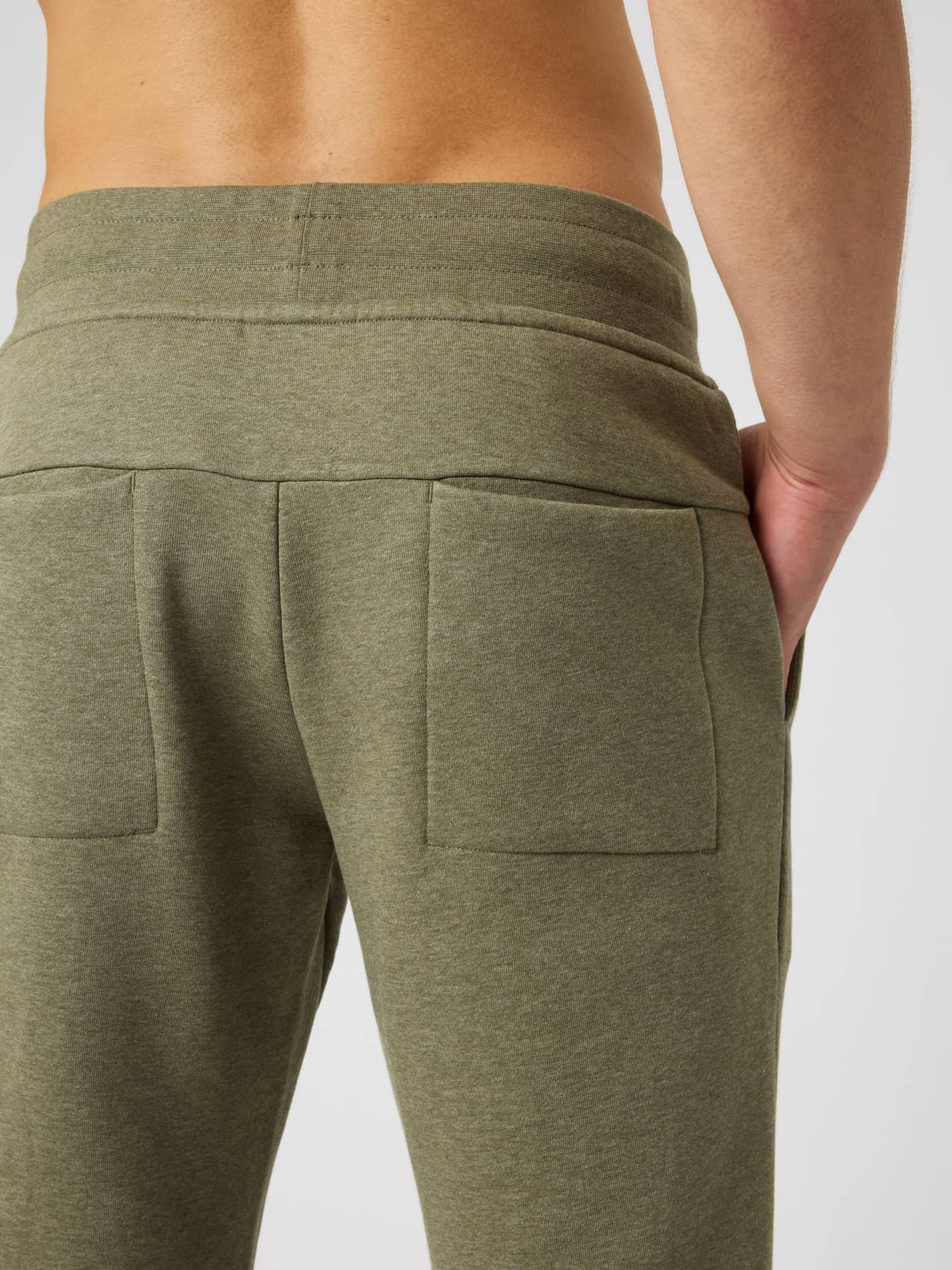 Back view of the Centre Tapered Sweatpants in Winter Moss Melange (Green) featuring two rear pockets. - Image 5