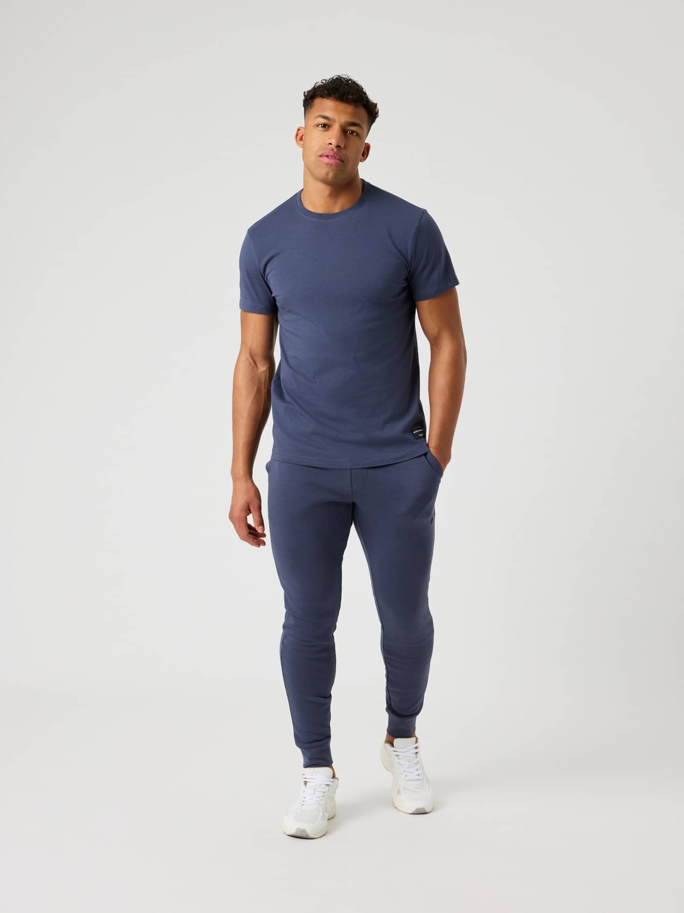 Full-body front view of a man wearing the Björn Borg Centre T-Shirt in Odyssey Gray (Grey), a regular fit cotton essential. - Image 3