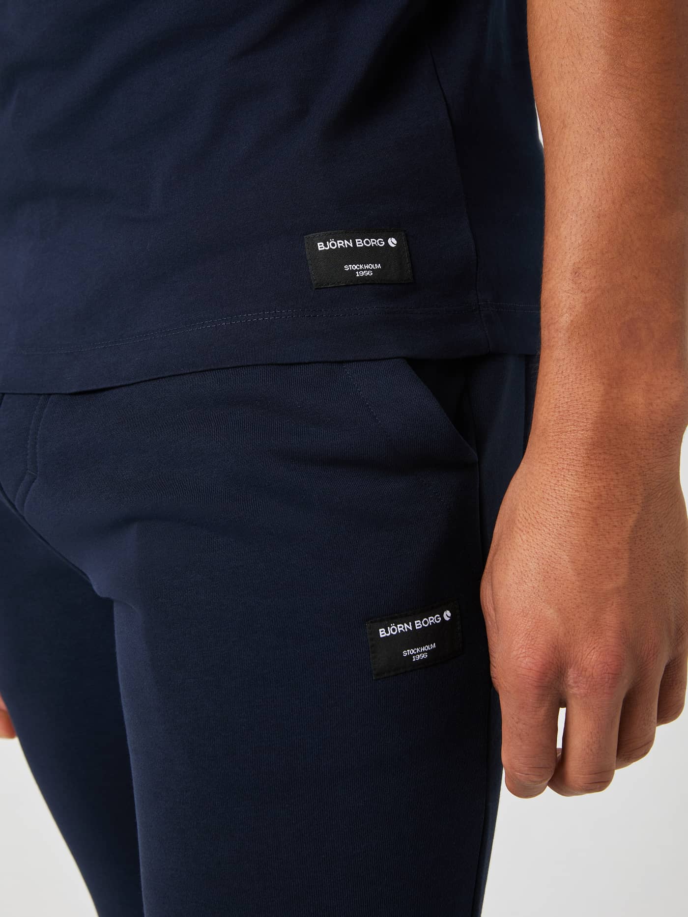 Detailed shot of the Björn Borg Centre T-shirt in night sky, showcasing the woven logo label on the front hem. - Image 5