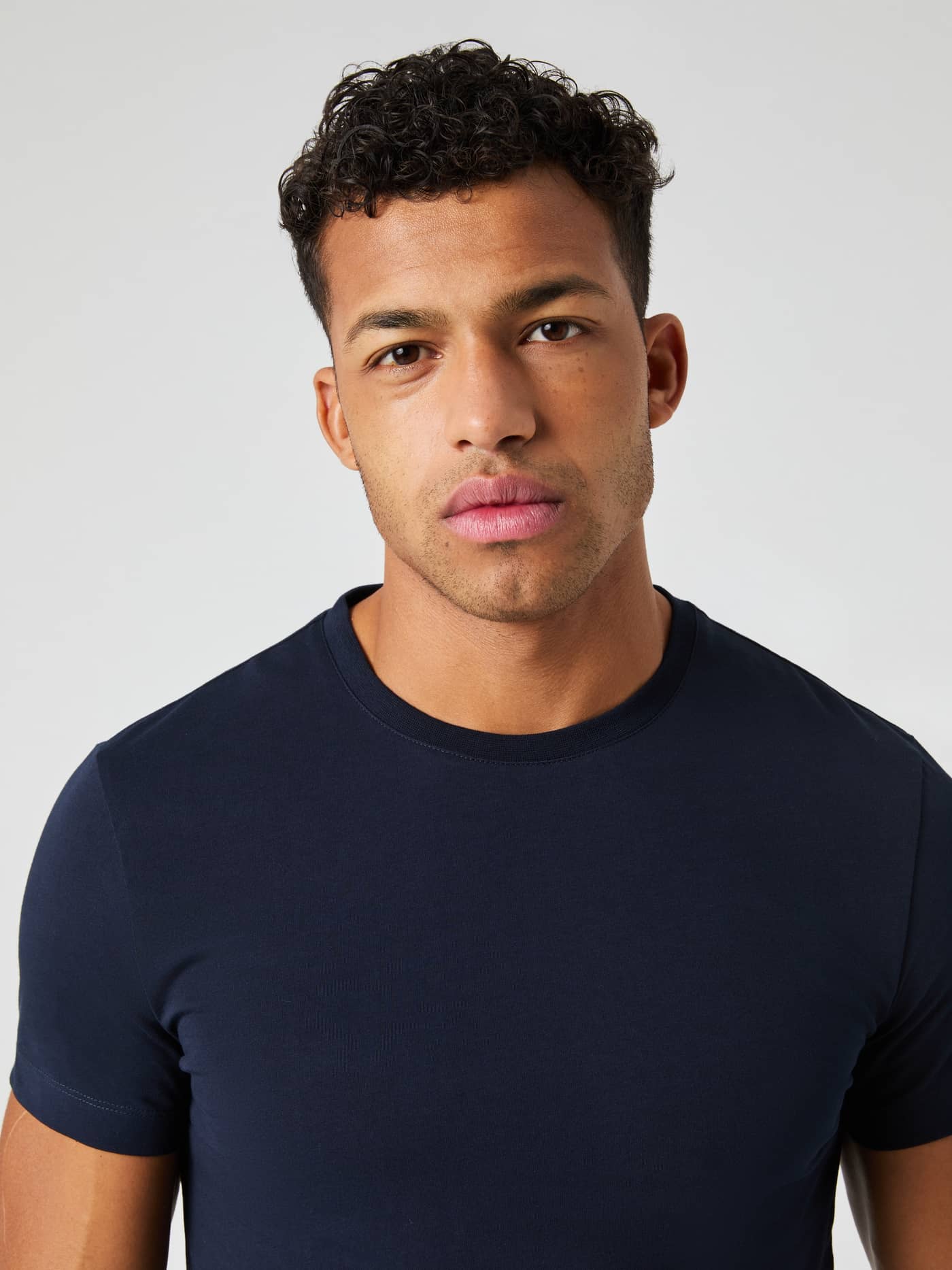 Close-up of a model wearing the Björn Borg Centre T-shirt in Night Sky, showcasing the fit and round neckline. - Image 4